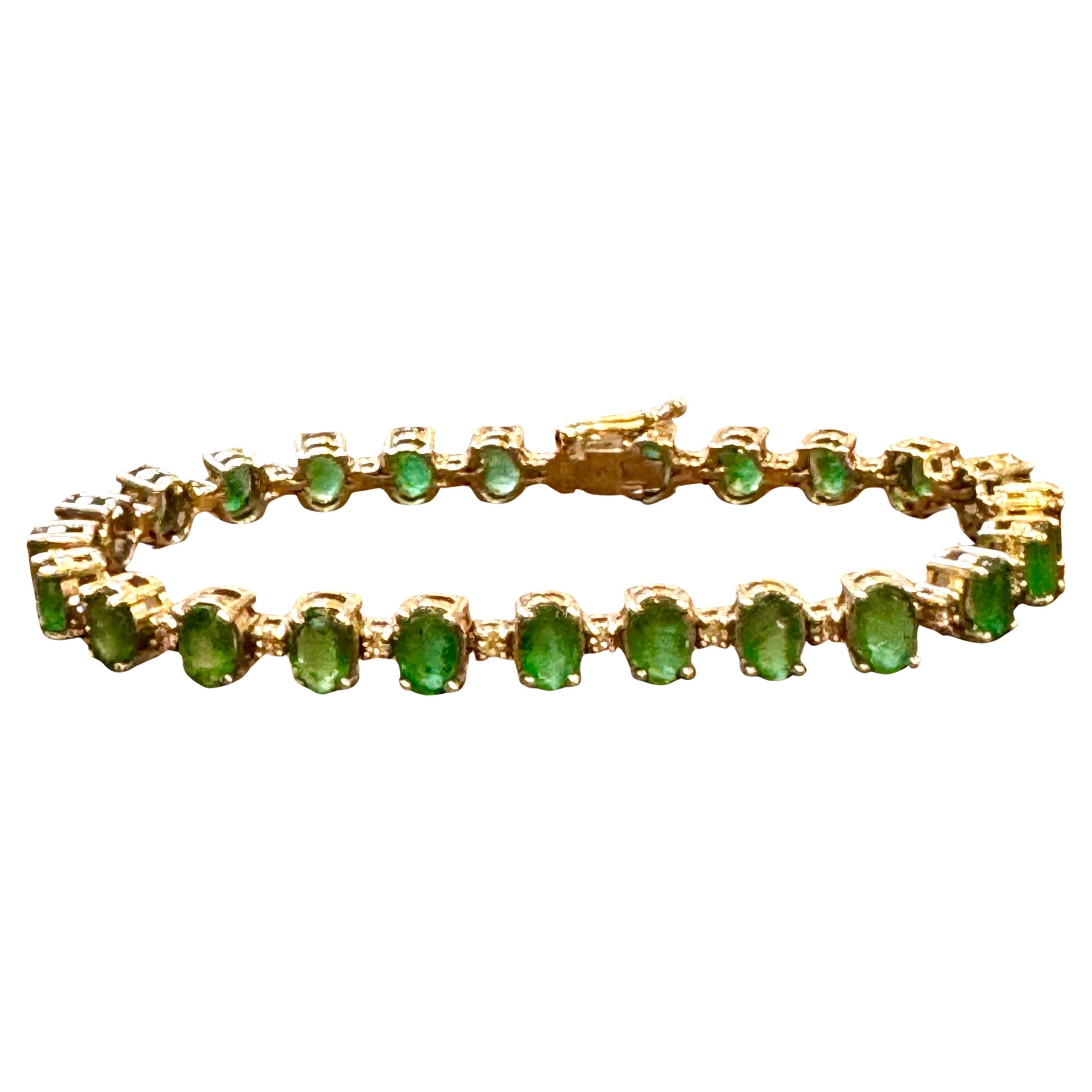  This exceptionally affordable Tennis  bracelet has  24 stones of oval  Emeralds  . Each Emerald is spaced by a single small approximately 3  pointer diamond . Total weight of the Emeralds is  approximately 12 Carat. Total number of diamonds are 24 