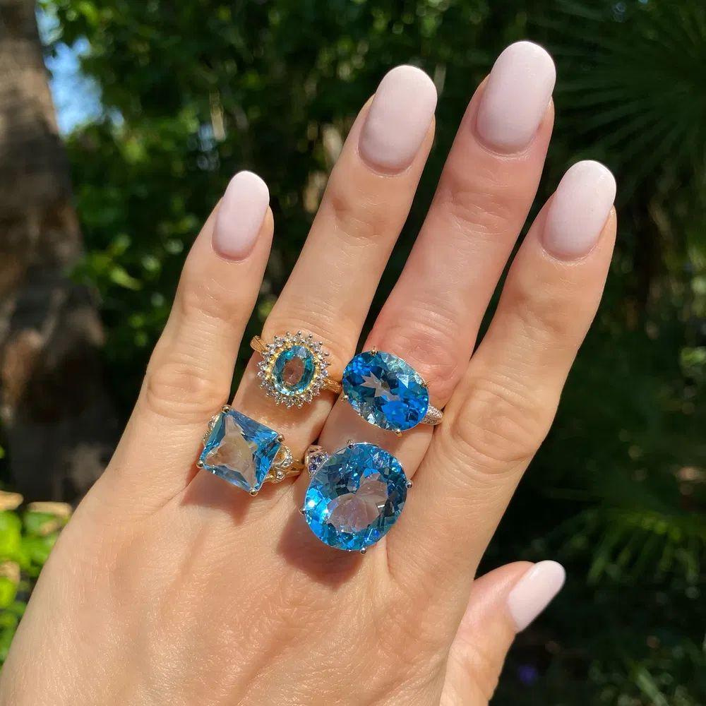 Modern 12 Carat Oval Blue Topaz and Sapphire Gold Solitaire Statement Cocktail Ring For Sale