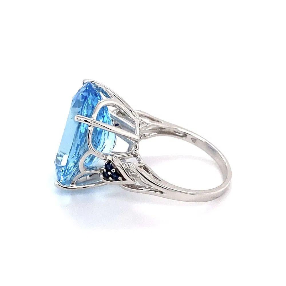 Women's 12 Carat Oval Blue Topaz and Sapphire Gold Solitaire Statement Cocktail Ring For Sale