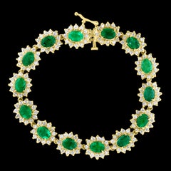 12 Carat Oval Cut Emerald and Diamond Tennis Bracelet 14 Karat Yellow Gold 23.5G