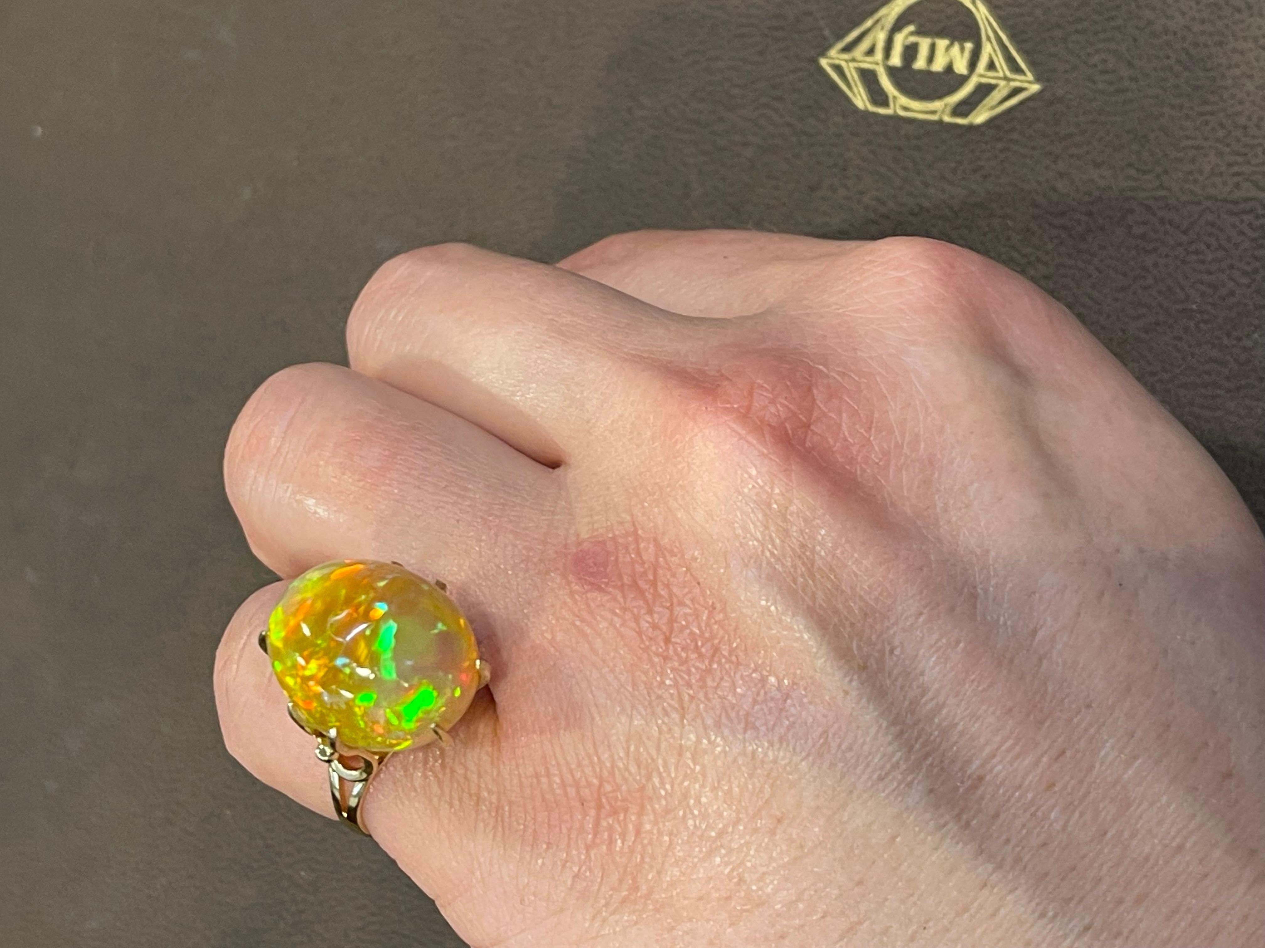 12 Carat Oval Shape Ethiopian Opal Cocktail Ring 14 Karat Yellow Gold For Sale 11