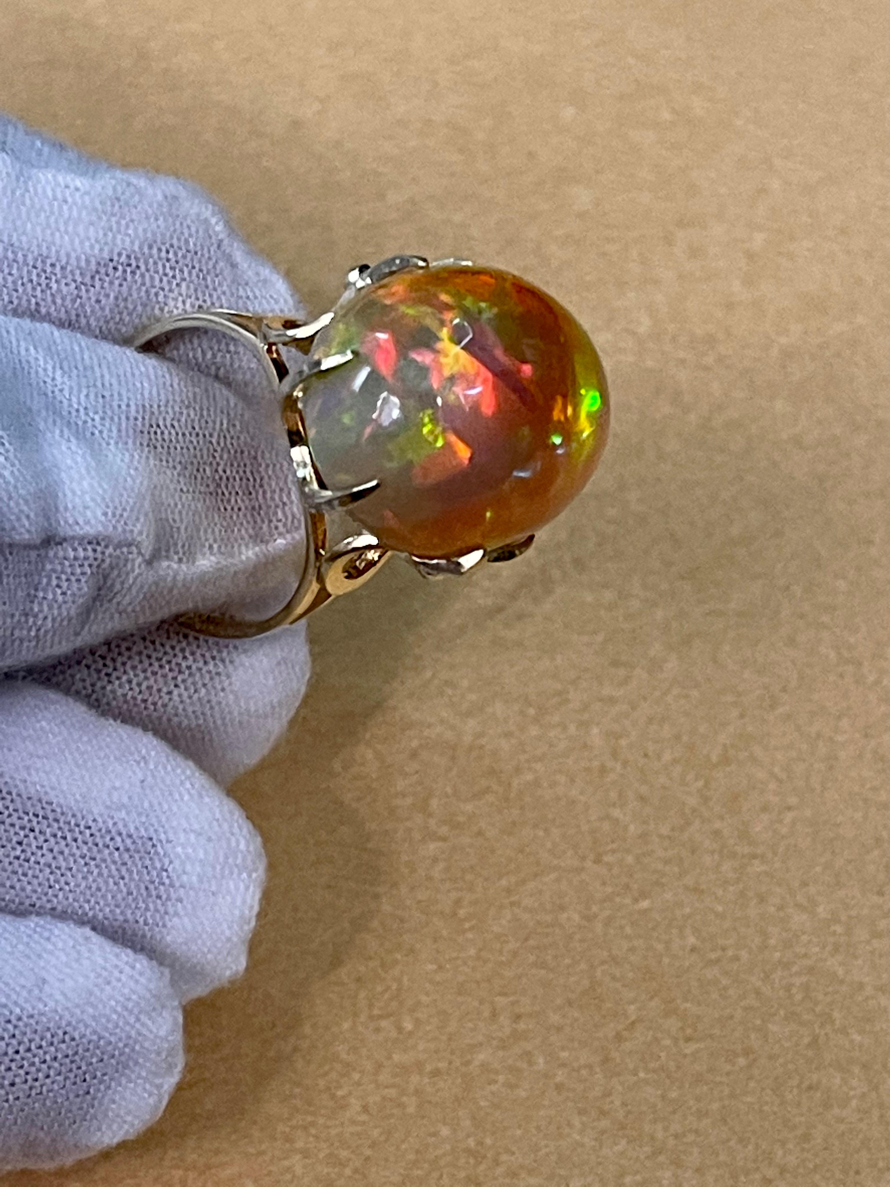 12 Carat Oval Shape Ethiopian Opal Cocktail Ring 14 Karat Yellow Gold In Excellent Condition For Sale In New York, NY