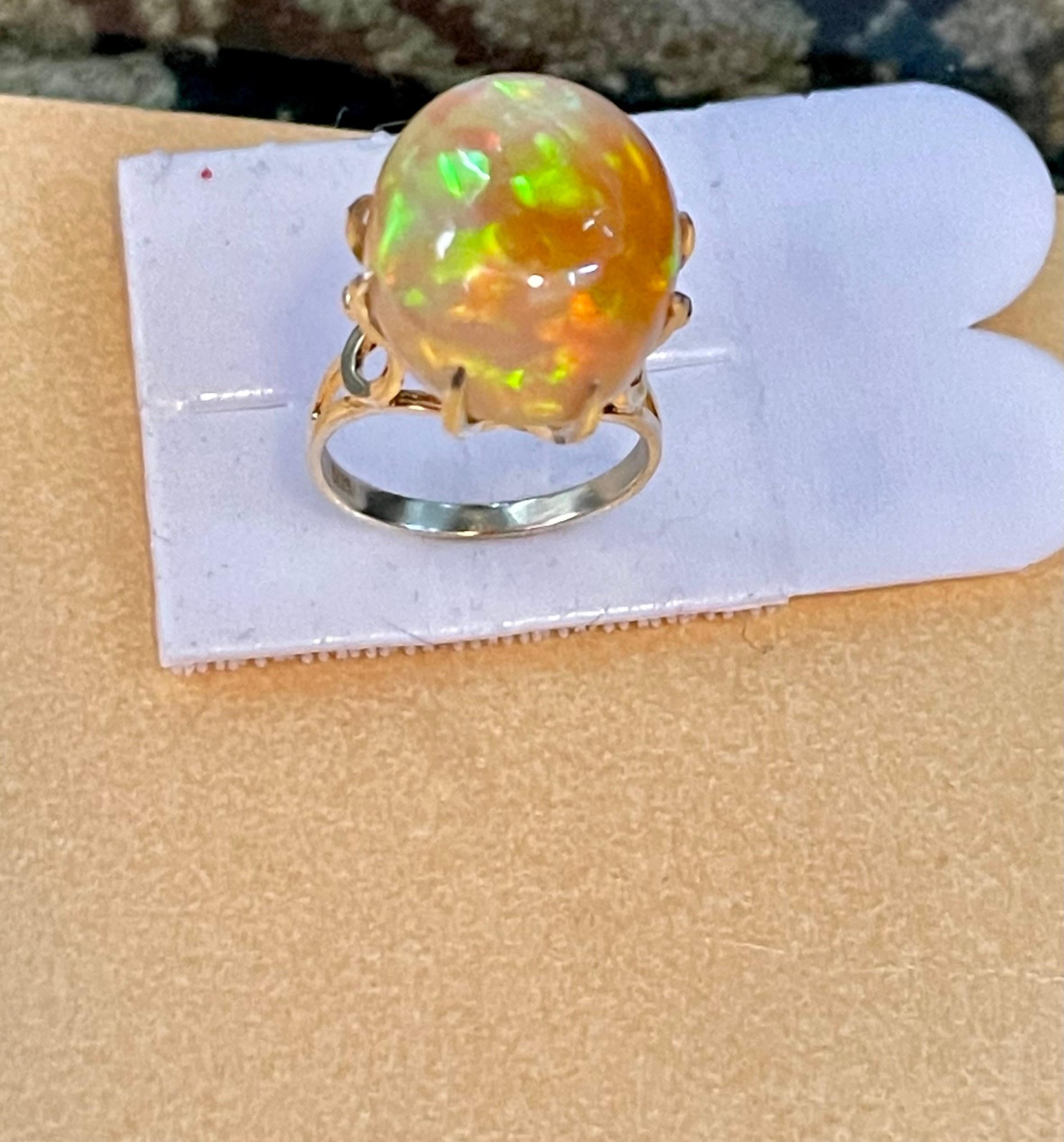 Women's 12 Carat Oval Shape Ethiopian Opal Cocktail Ring 14 Karat Yellow Gold For Sale