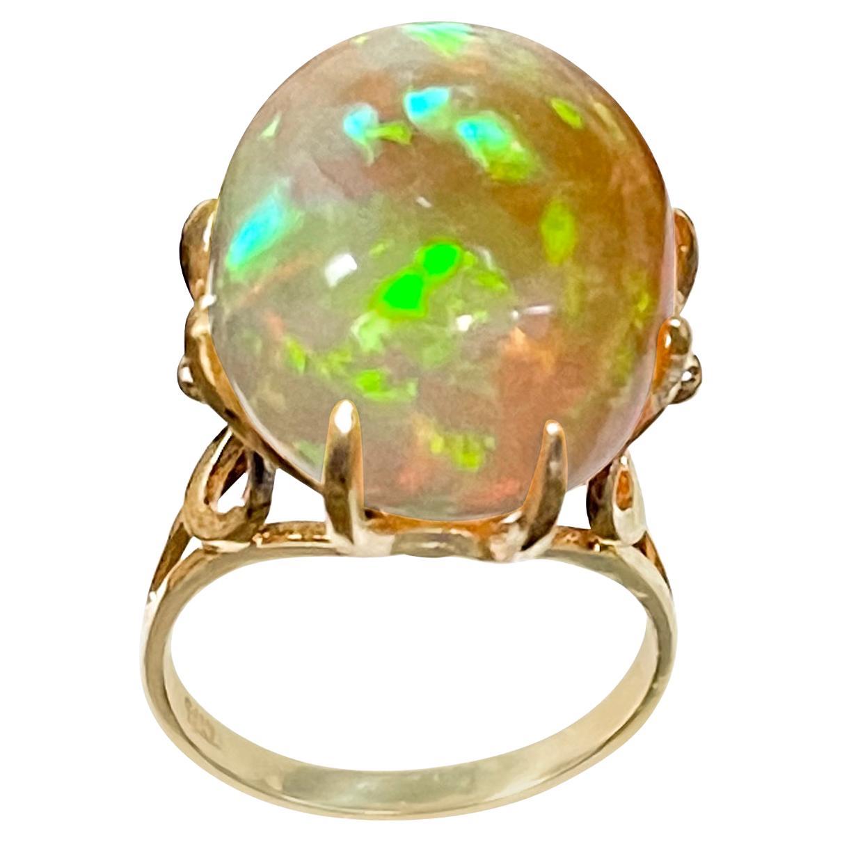 12 Carat Oval Shape Ethiopian Opal Cocktail Ring 14 Karat Yellow Gold For Sale