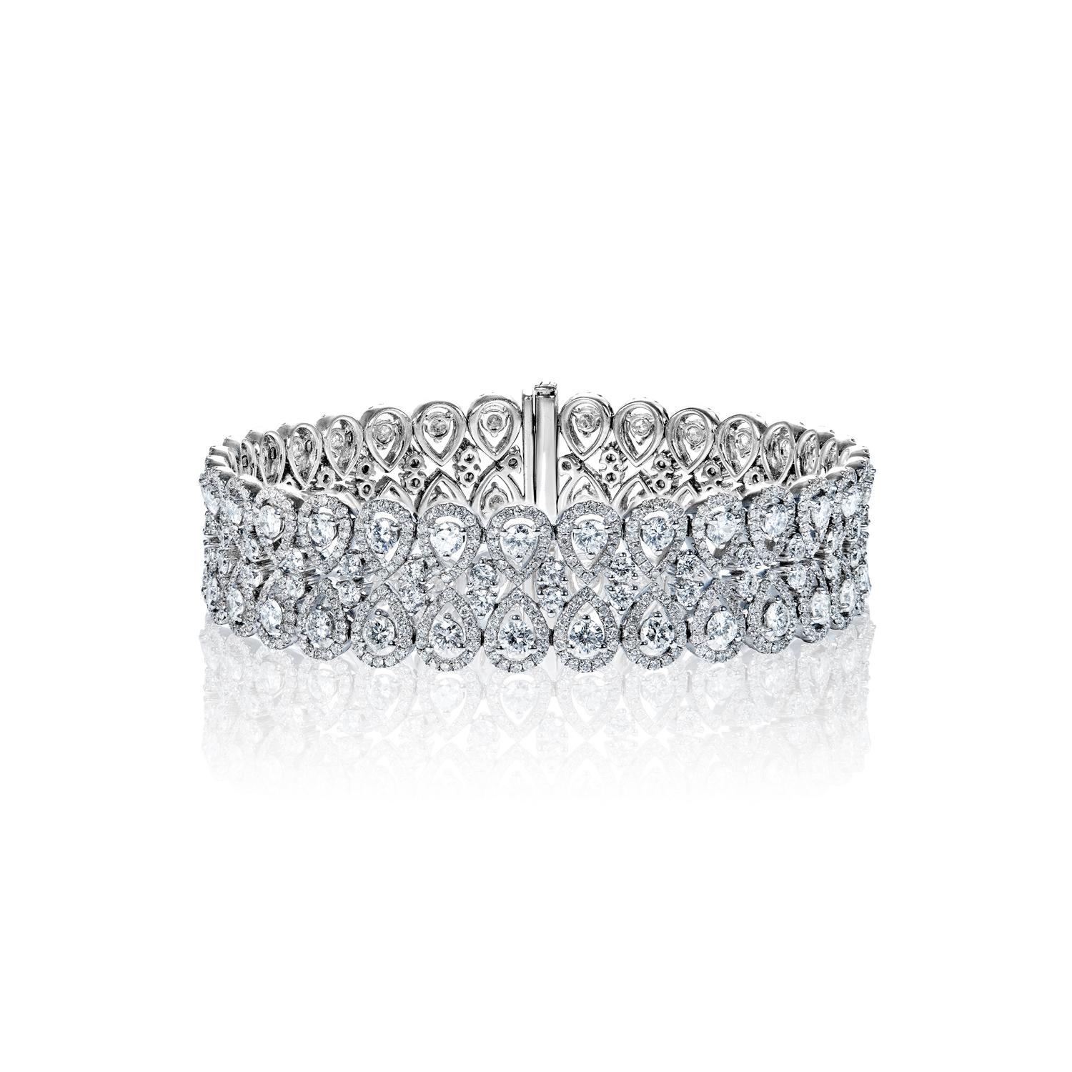 Style: Diamond Double Row Bracelet
Diamonds
Diamond Size: 6.26 Carats
Diamond Shape: Pear Shape

Diamond Size: 5.25 Carats
Diamond Shape: Round Brilliant Cut

Setting
Metal: 18K White Gold
Clasp: Box catch with hidden safety

Total Carat Weight: