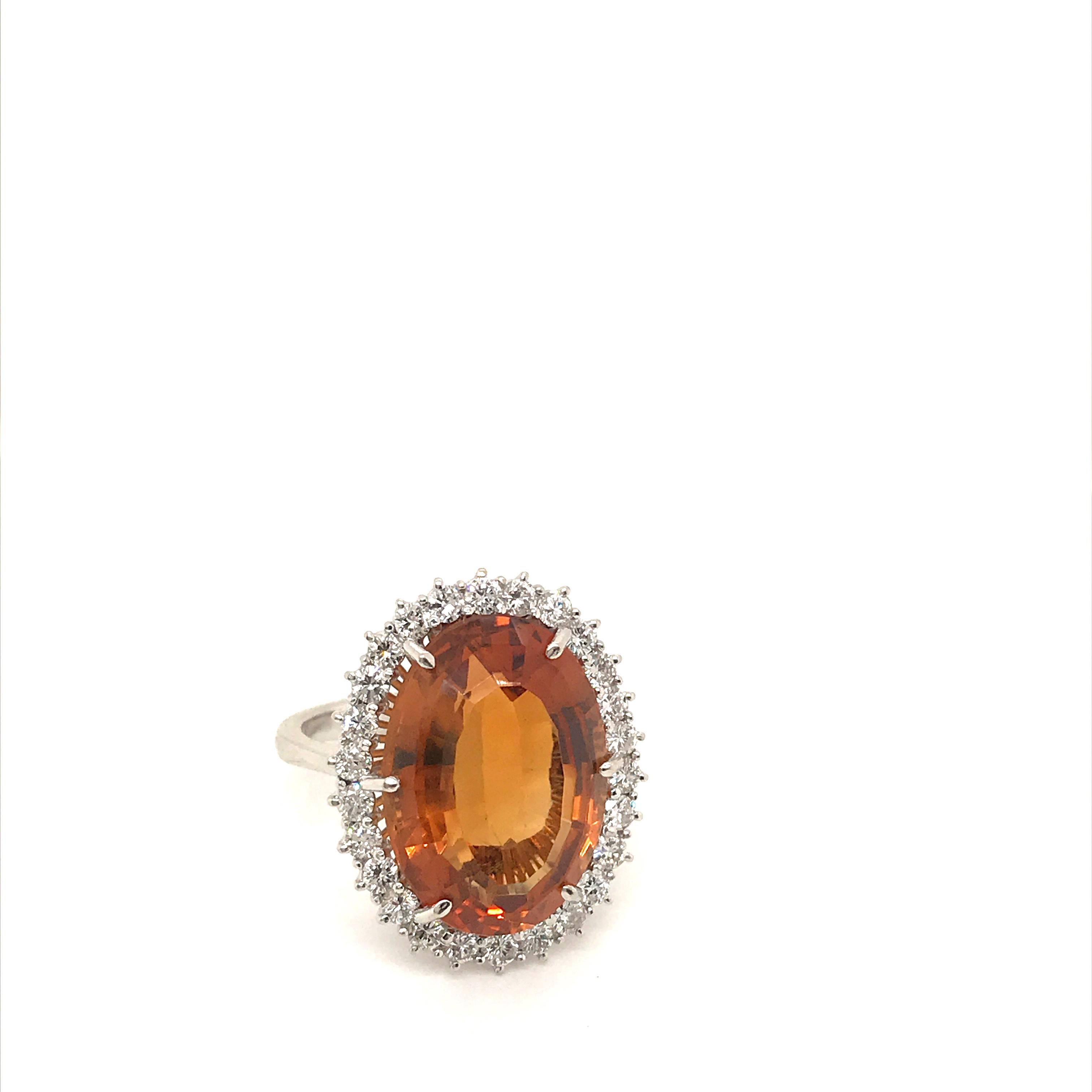 Stunning Cluster ring set in the center with a beautiful quartz citrine weighing approx 12 carats, and surrounded by approx. 1.10 carat of diamonds. Circa 1970

CONDITION: Pre-Owned - Excellent
METAL: 18k gold
GEM STONE: Quartz citrine 12 ct -