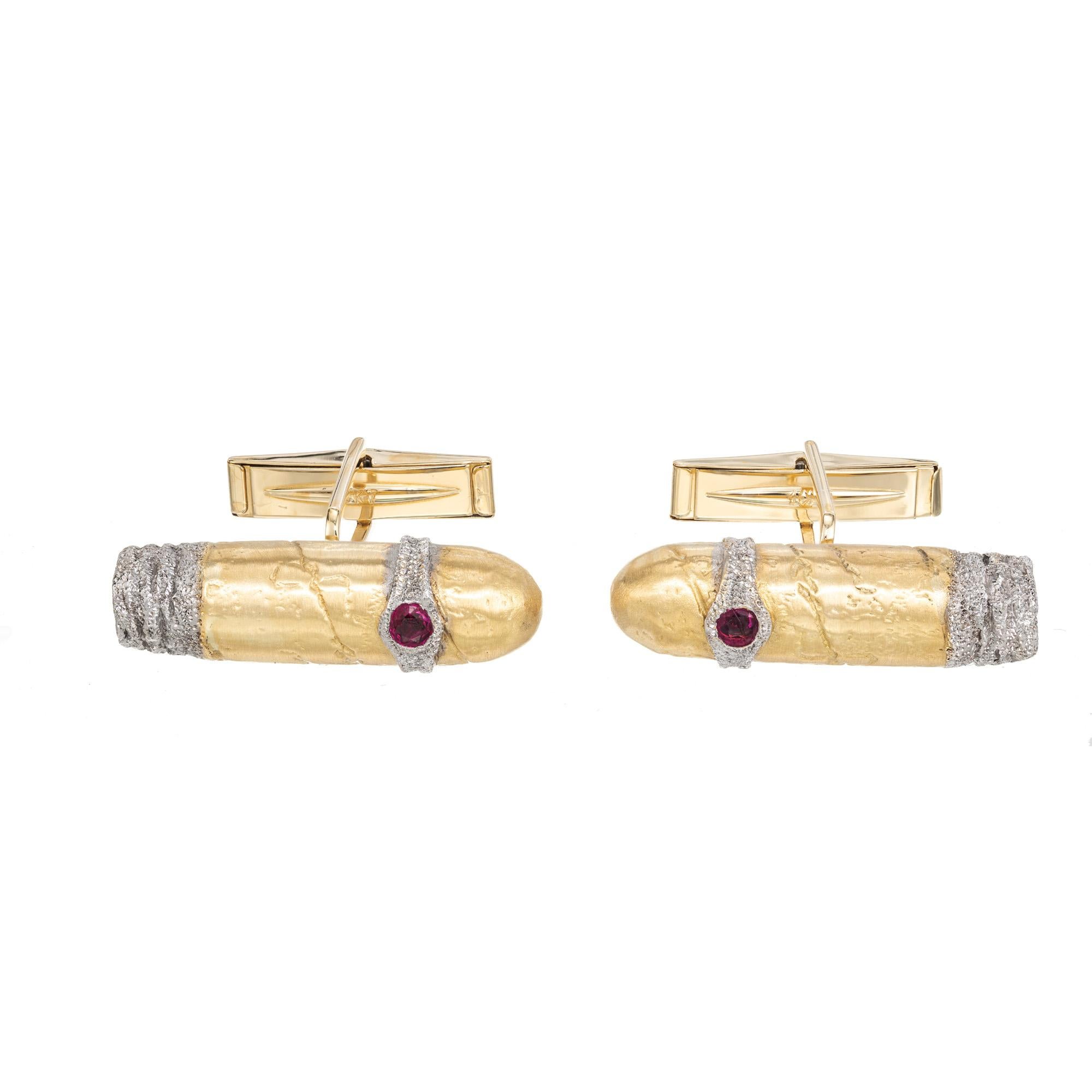Beautiful 3D designer men's cufflinks. Unique cigar styled 18k yellow and white gold textured finish cufflinks. The cigar band and tip are textured white gold. Each cigar band is adorned with one round ruby.

2 round red rubies, approx. .12cts
18k