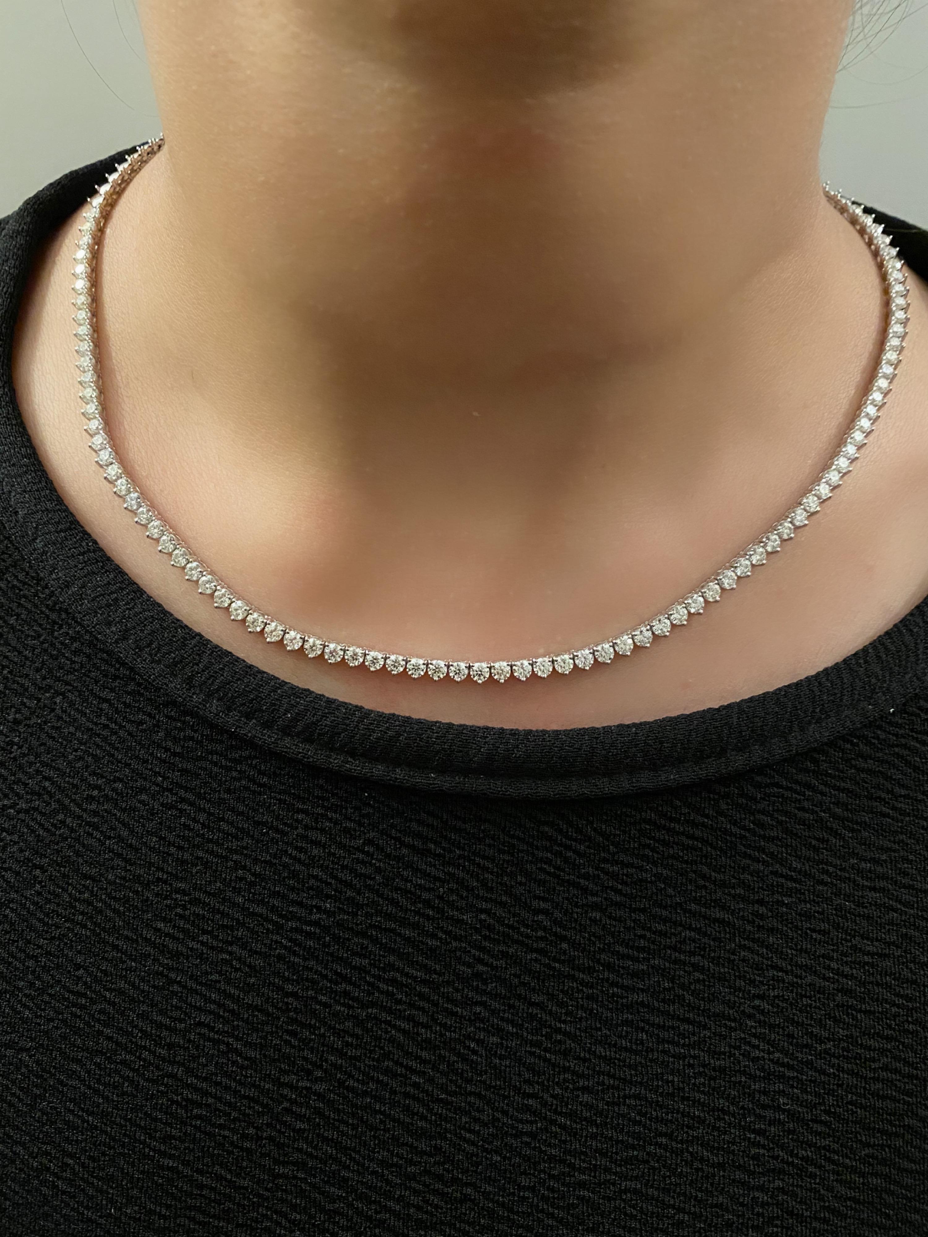 Made from perfectly cut hearts and arrow diamonds, this tennis single-line necklace guarantees luster and sparkle, like none other.

Diamond Details
Shape: Round 
Color: F 
Clarity: VVS2 
Weight: 8 Carats 

Necklace Details
18K Gold 
