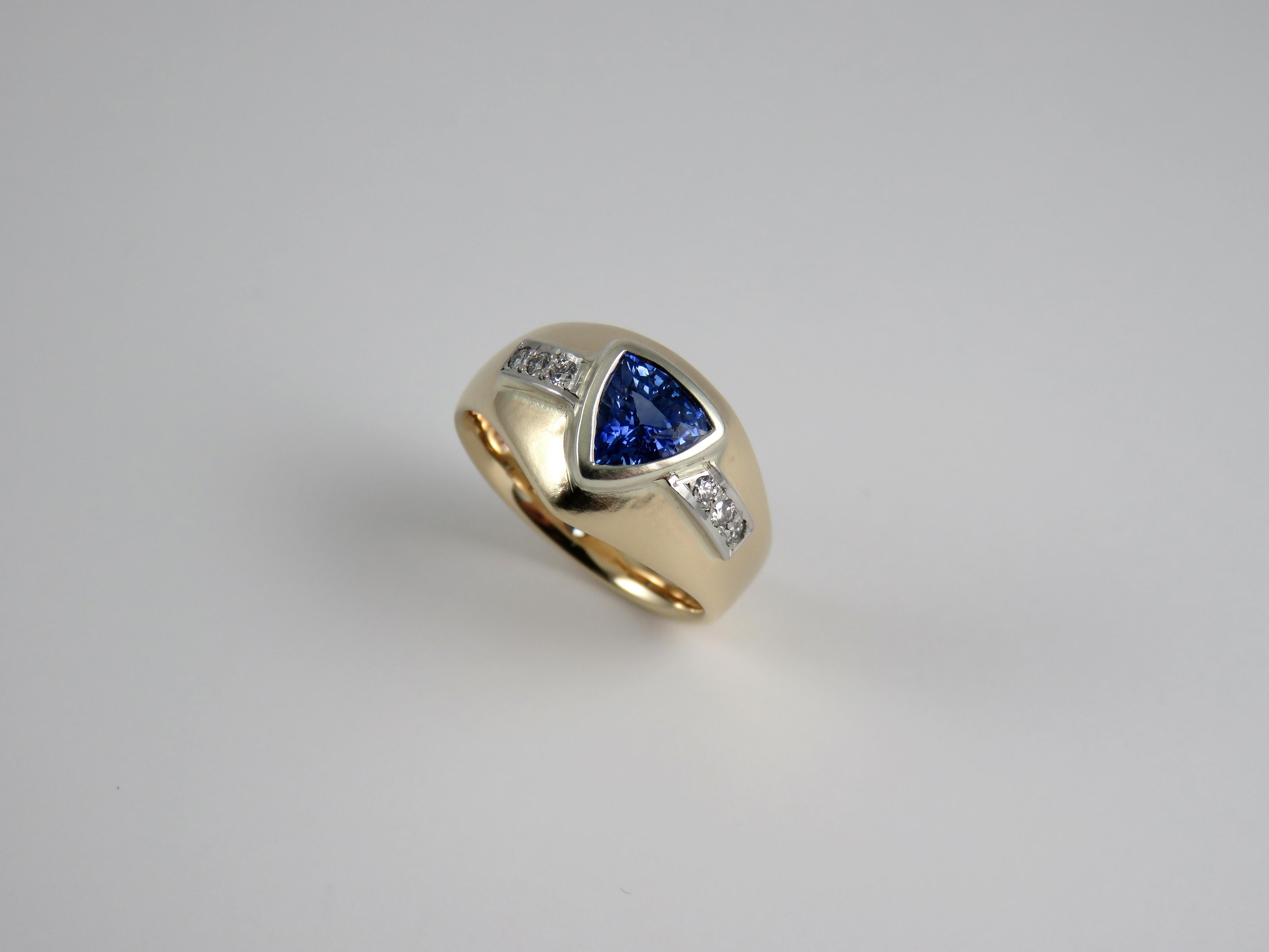 Introducing this alluring one off handmade assembled Yellow Gold and Platinum Trillion Blue Sapphire and Diamond dress ring.    

The sapphire symbolises power and strength, but can also mean kindness and wise judgement.  

The uniqueness speaks for