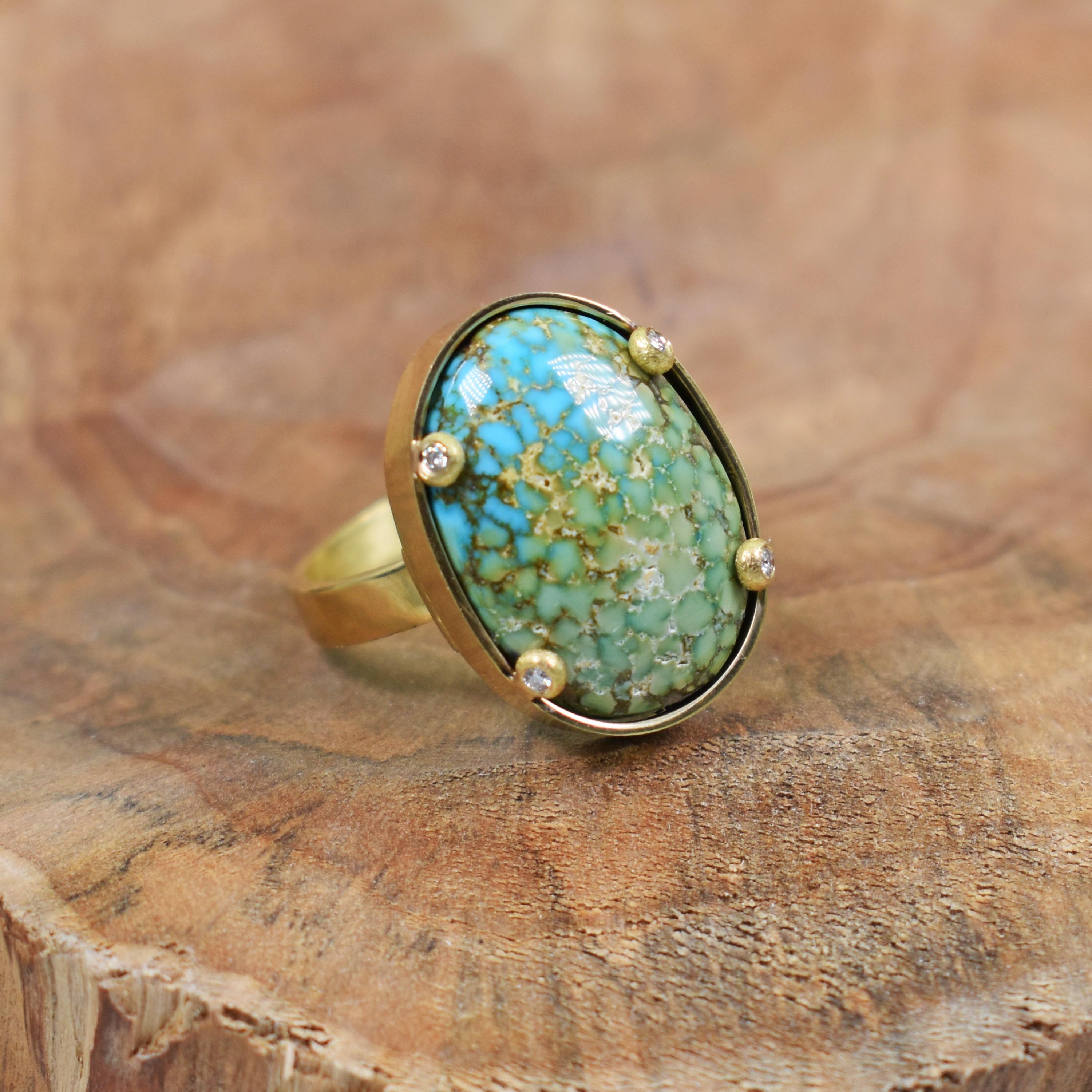 Beautiful 12 carat Turquoise Mountain Turquoise with 0.06 carats accent white diamonds set in 18k yellow gold handmade ring. Ring is size 6, and ring band is 3mm wide. Gorgeous Turquoise gemstone with rich yellow gold in this contemporary and