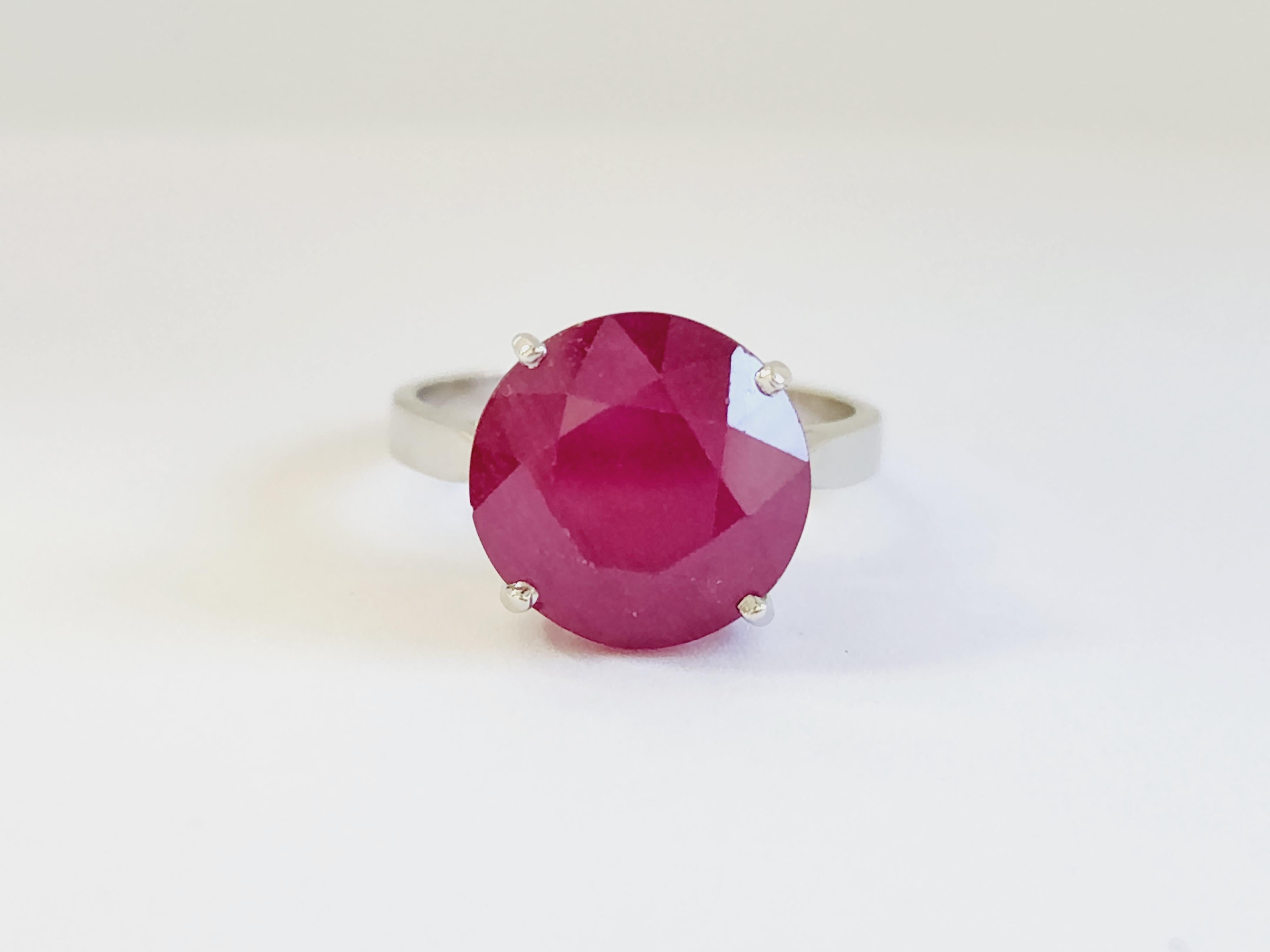 12 Carats Ruby Round Classic 4 Prong Setting White Gold Ring 14 Karat. Unique, Brilliant, and Beautiful.

Cushion Ruby Size: 12 Carats
Ring Size: 9
Glass Filled