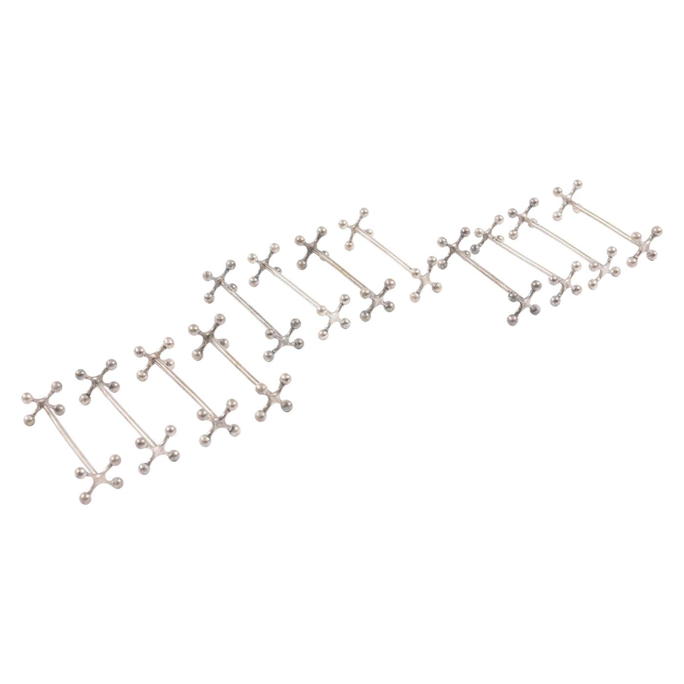 12 Christofle Knive Rests, Silver Plated Hand Chased Details at 1stDibs