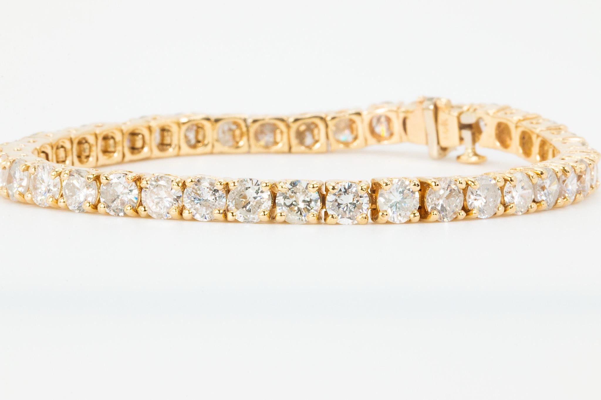 12 CT Diamond Tennis Bracelet in 14K Yellow Gold

A timeless classic, this elegant diamond tennis bracelet is crafted in 14K yellow gold and set with 40 round brilliant cut natural diamonds, weighing approximately 12 carats total. The diamonds,