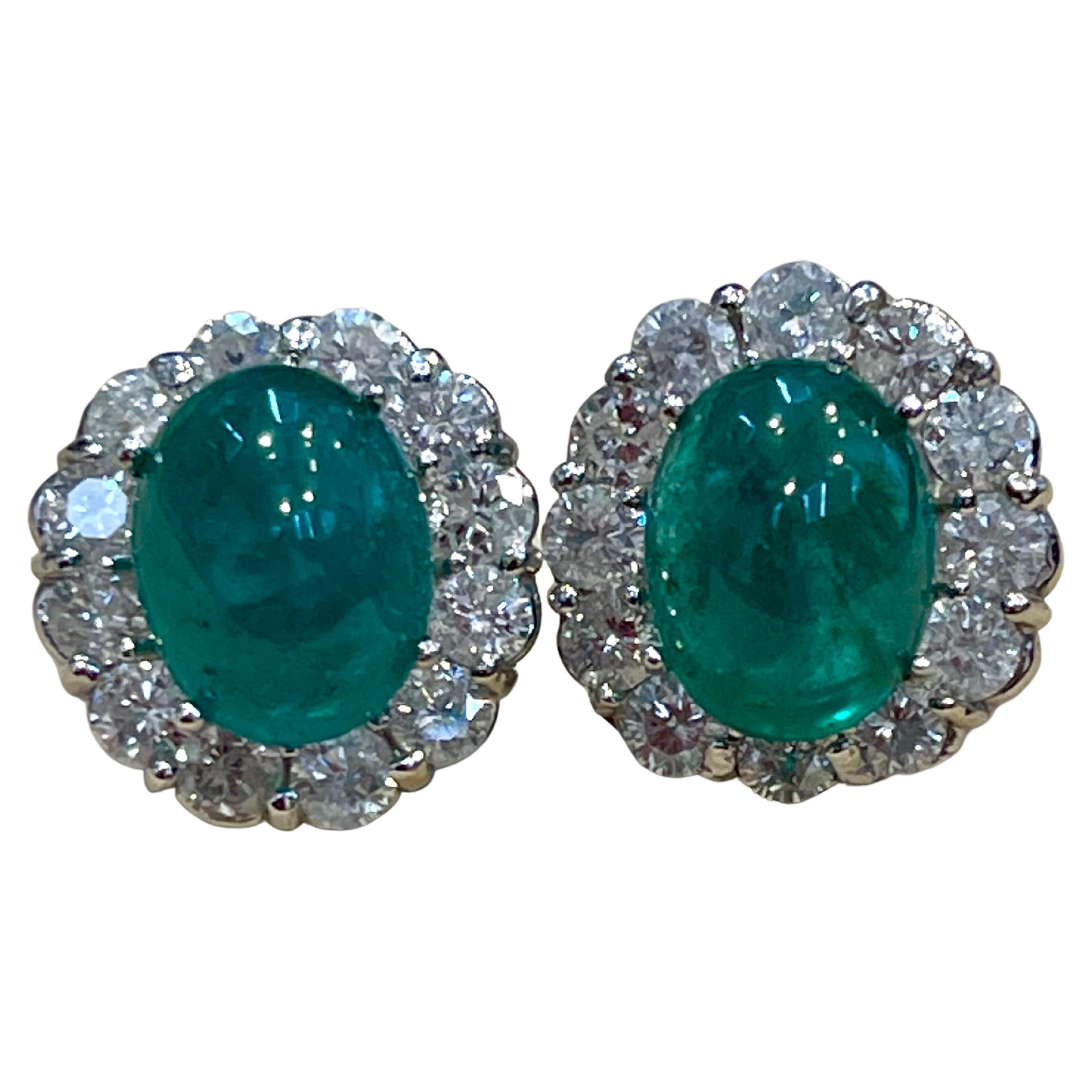 Approximately 12  Carat of Natural Zambian Emerald Cabochon and 4 Ct diamonds  earrings in White gold

Each  Emerald is about 6 carat 
Very desirable color and quality. Extreme fine color and clarity.
perfect matching pair made in 14 Karat White