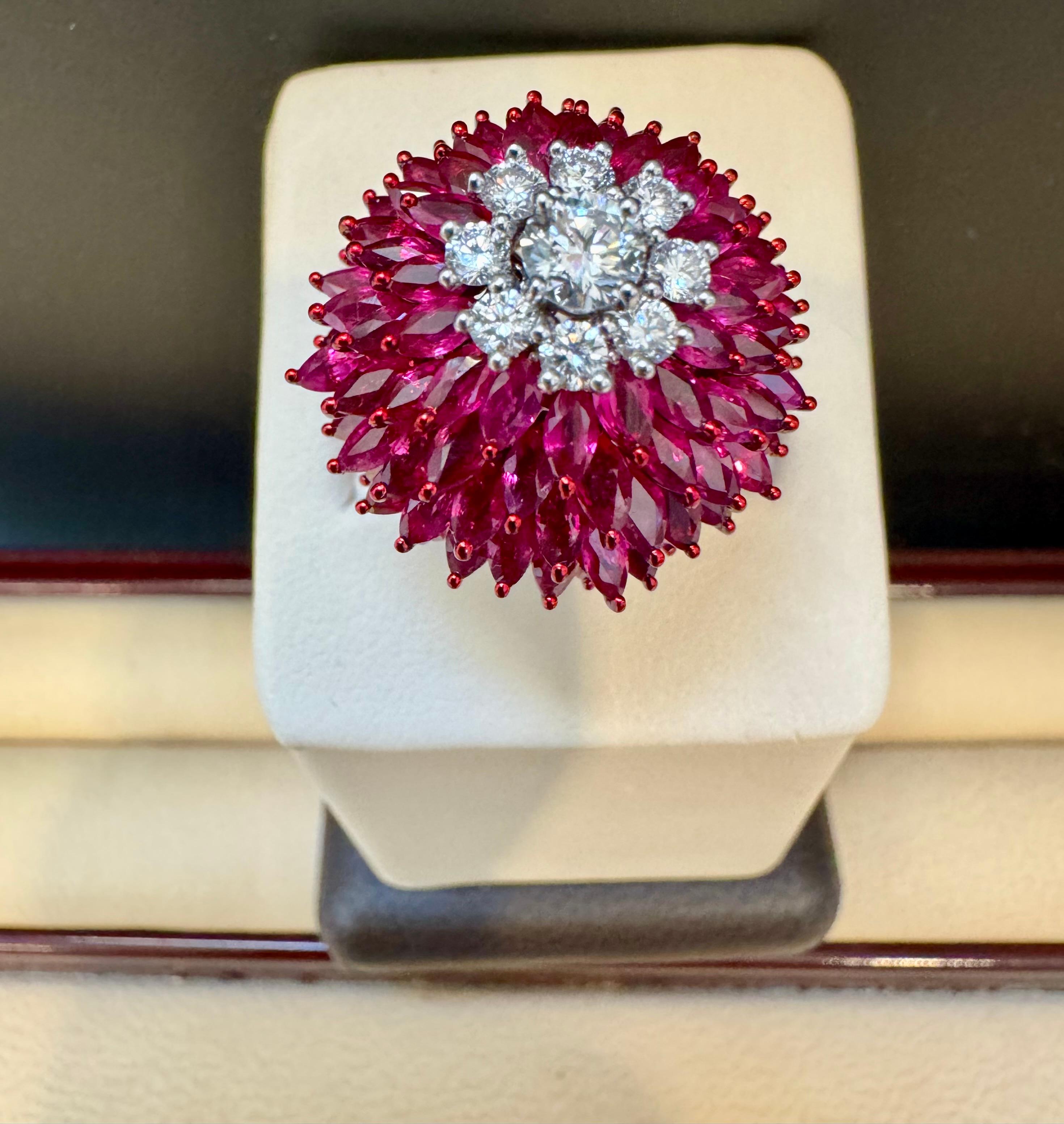 12 Ct Natural Marquis Ruby & 0.75 Ct Diamond 18 Kt White Gold Ball Ring Size 6
Introducing our exquisite 18 Karat Gold Ring, featuring a stunning 12 carat natural Marquise Ruby and approximately 0.75 carats of brilliant cut diamonds. This ring is a