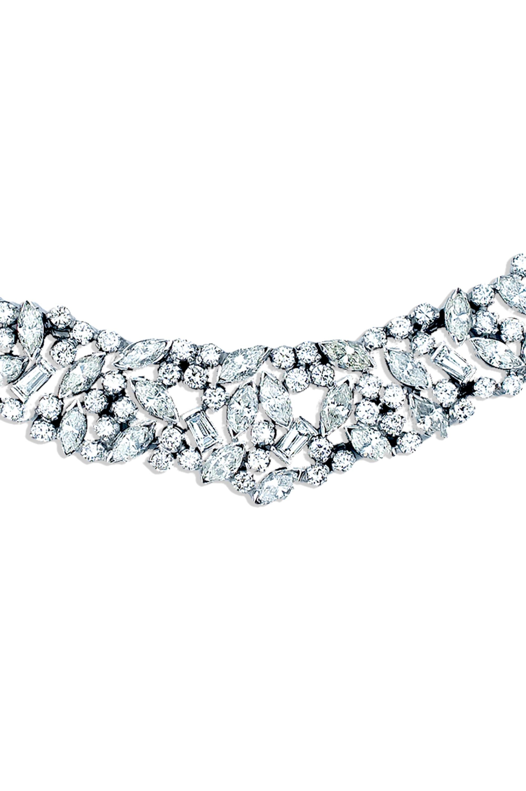 This important diamond necklace has such a lovely layout.  This necklace has a diamond total weight which is appx. 12 carats.  The carat weight of the diamonds is accounted for as ninety one round brilliant diamonds that measure on average 2.7mm and