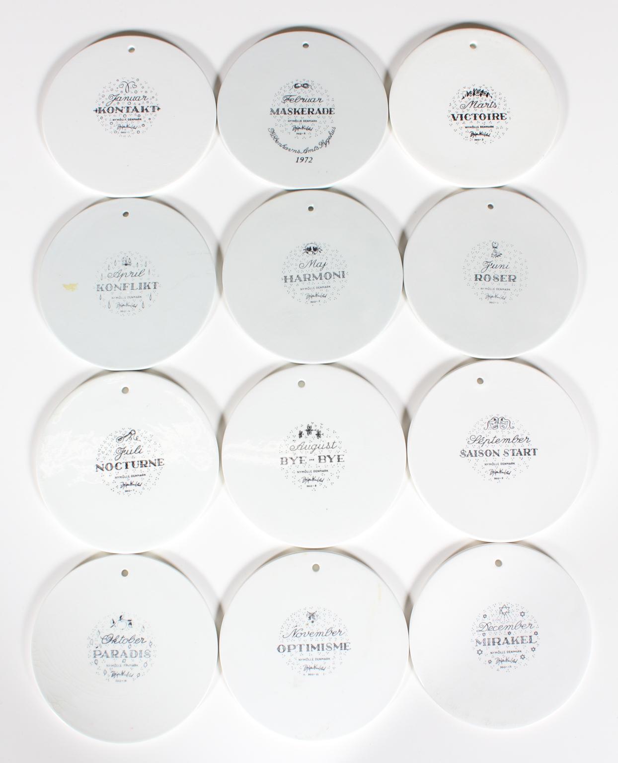 A complete set of 12 beautiful black and white wall plates, designed by Bjorn Wiinblad for Nymolle Denmark, 1970s. 

Each of these plaques represents a month. They display the charming story of a young couple from falling in love in January, getting