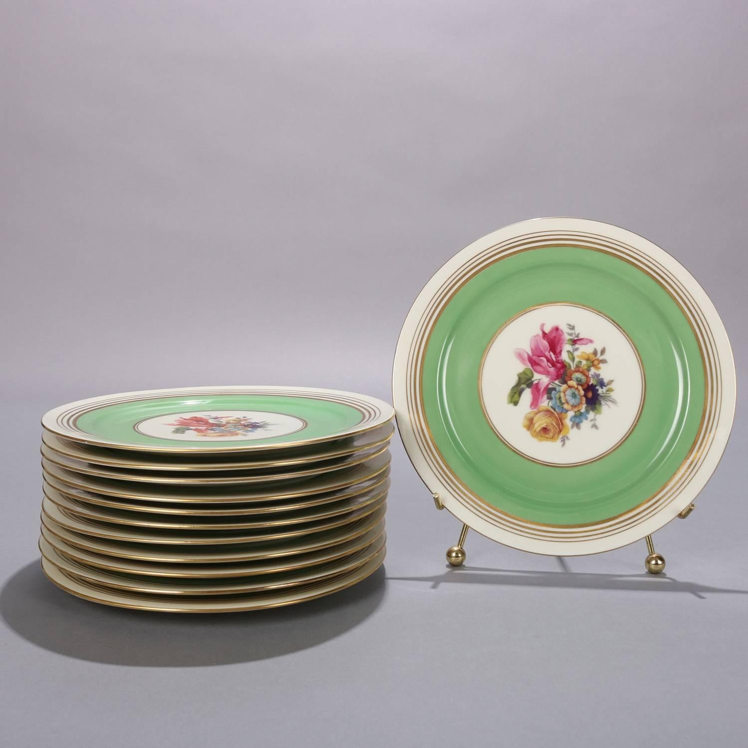 Set of 12 Dresden School Czech porcelain dinner plates by Puls feature green and gilt rim with central floral bouquet, en verso crown Puls mark, 20th century

Measures: .75
