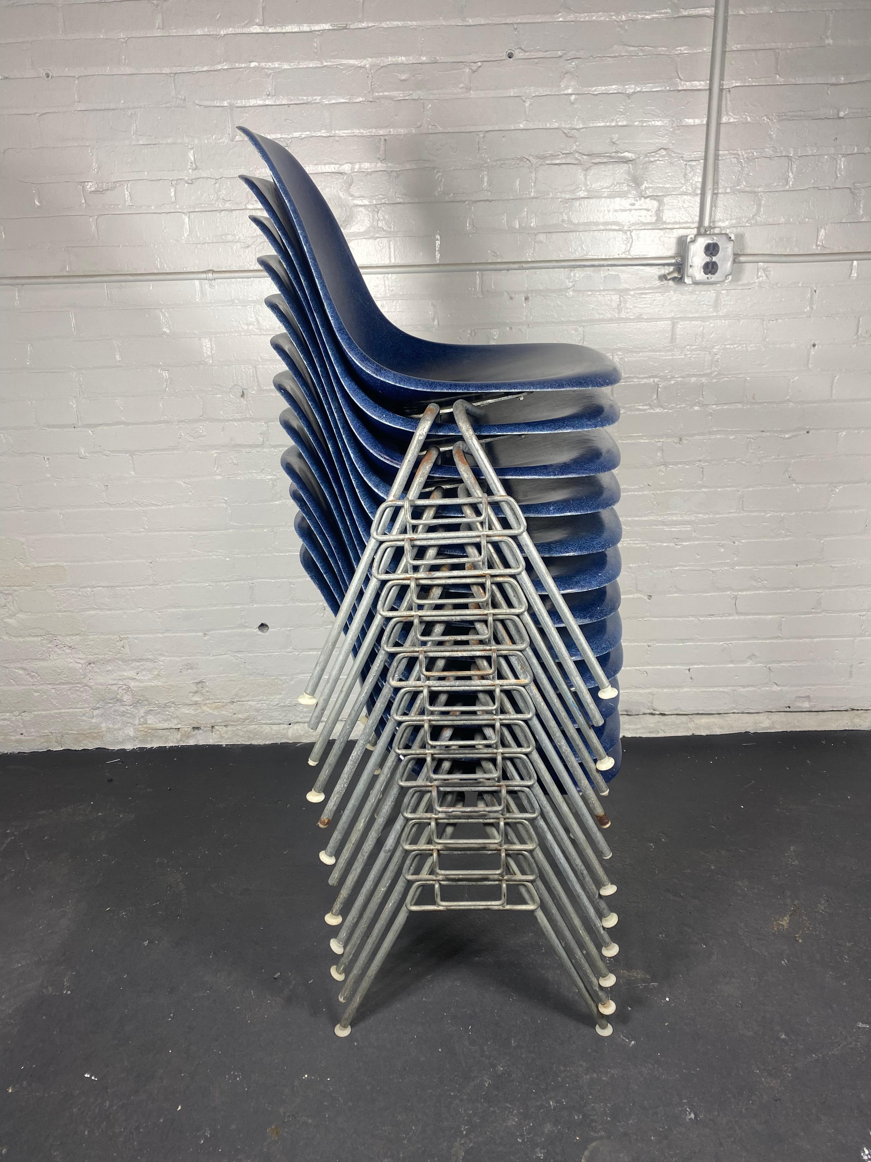 One of 12 stackable dining room chairs by Charles & Ray Eames for Herman Miller, manufactured in midcentury, 1960s.
The chairs are labeled on the underside of the seats with 'herman miller' and stamped .Stunning set.. Rare color !  Ultramarine Blue 