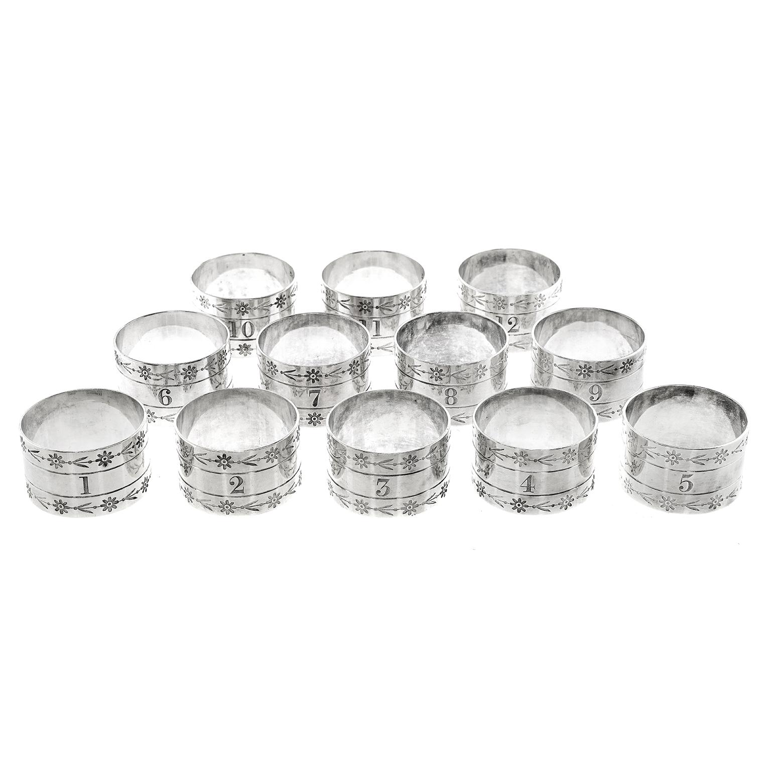 Circa 1849, Silver-plate, by Elkington & Co., Birmingham, England.  Found in their original box, this gorgeous set of silver-plate napkin rings by the esteemed British Silver company, Elkington & Co, feature hand engraved bright cut flower