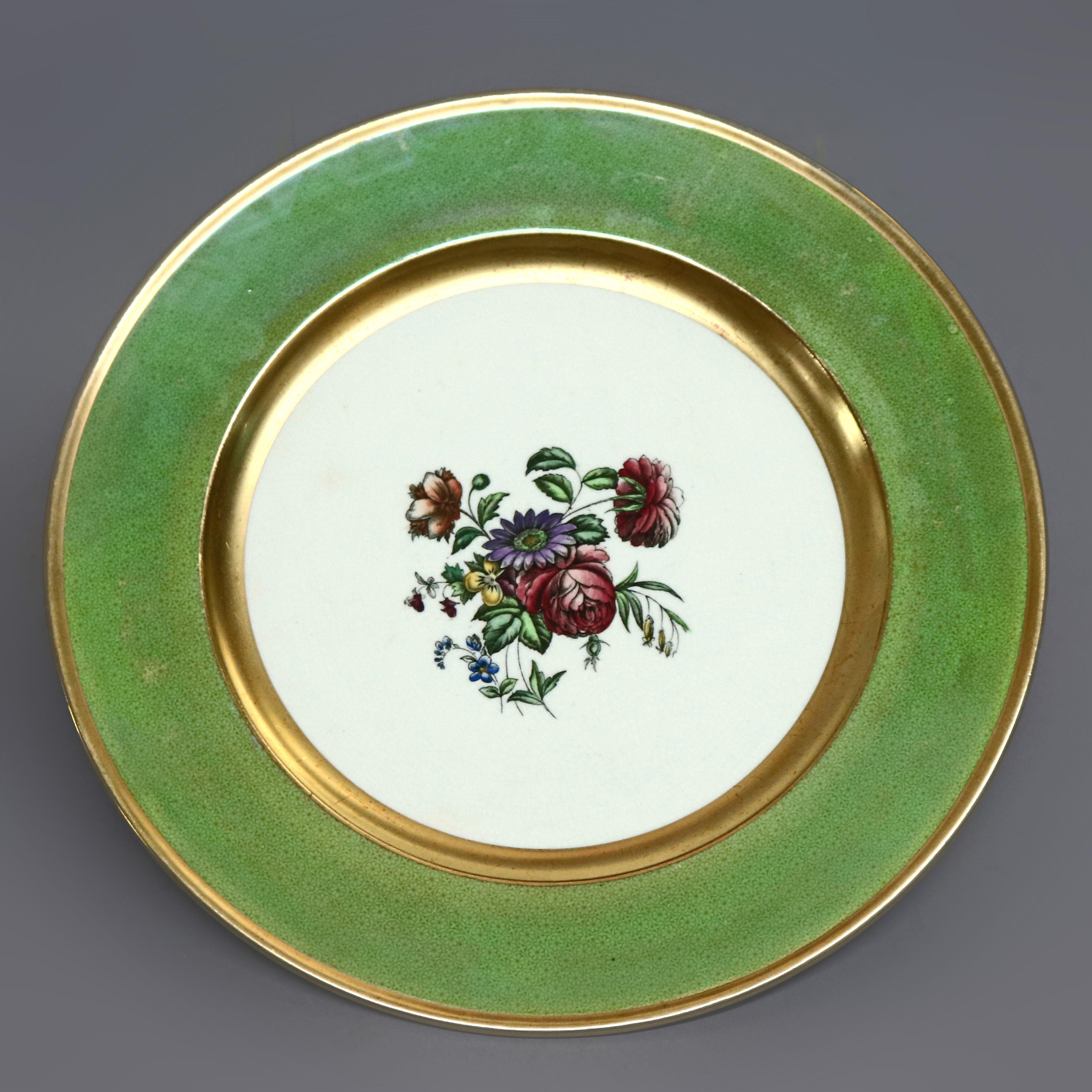 An antique set of 12 English dinner plates by Cauldon offer central floral bouquet with green rim bordered in gilt trimming, en verso maker mark as photographed, circa 1920.

Measures: 10.25