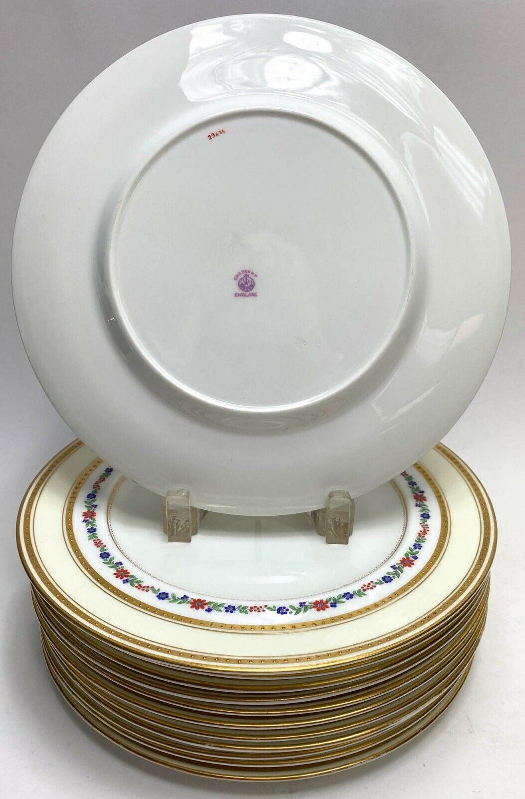 12 English George Jones Crescent dinner plates w/ enamel flower band, c1920

12 George Jones Crescent dinner plates with crème colored ground and colorful enamel floral band and gilt band around rim.

Additional information:
Material: Porcelain