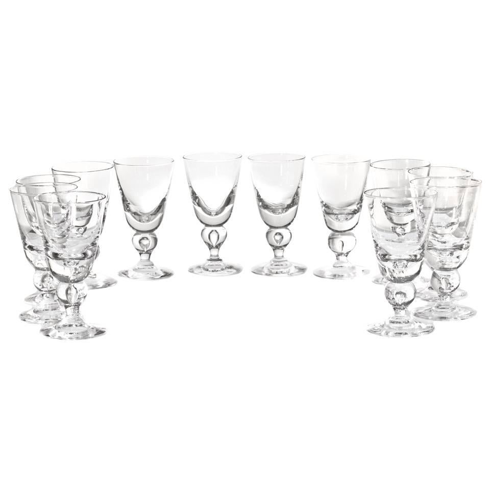 Circa 1940, by the Steuben Glass Works, Corning, NY.  Known as the #7877 baluster stem, this is the most coveted of all modernist glasses. Intended as a water glass, today these goblets find more usage as wine goblets. This George Thompson design is