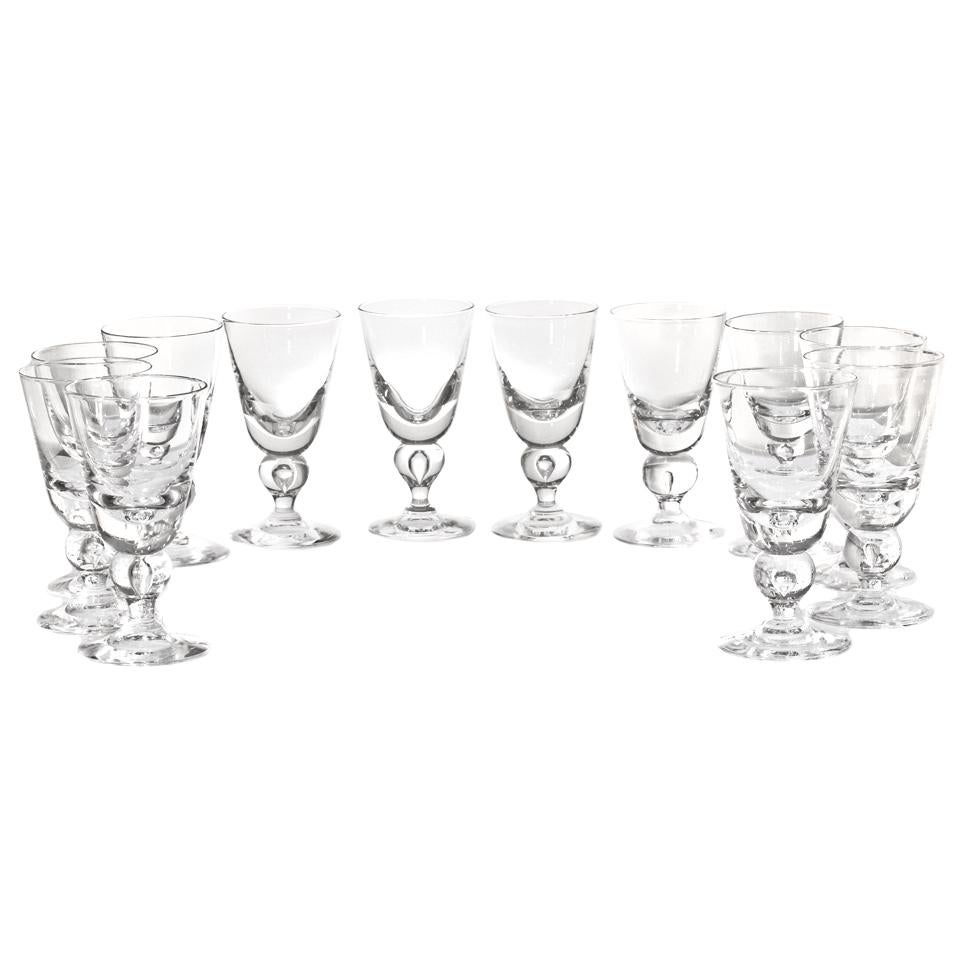 By the Steuben Glass Works, Corning, NY. known as the #7877 baluster stem, this is the most coveted of all modernist glasses. Intended as a water glass, today these goblets find more usage as wine goblets. This George Thompson design is perfectly
