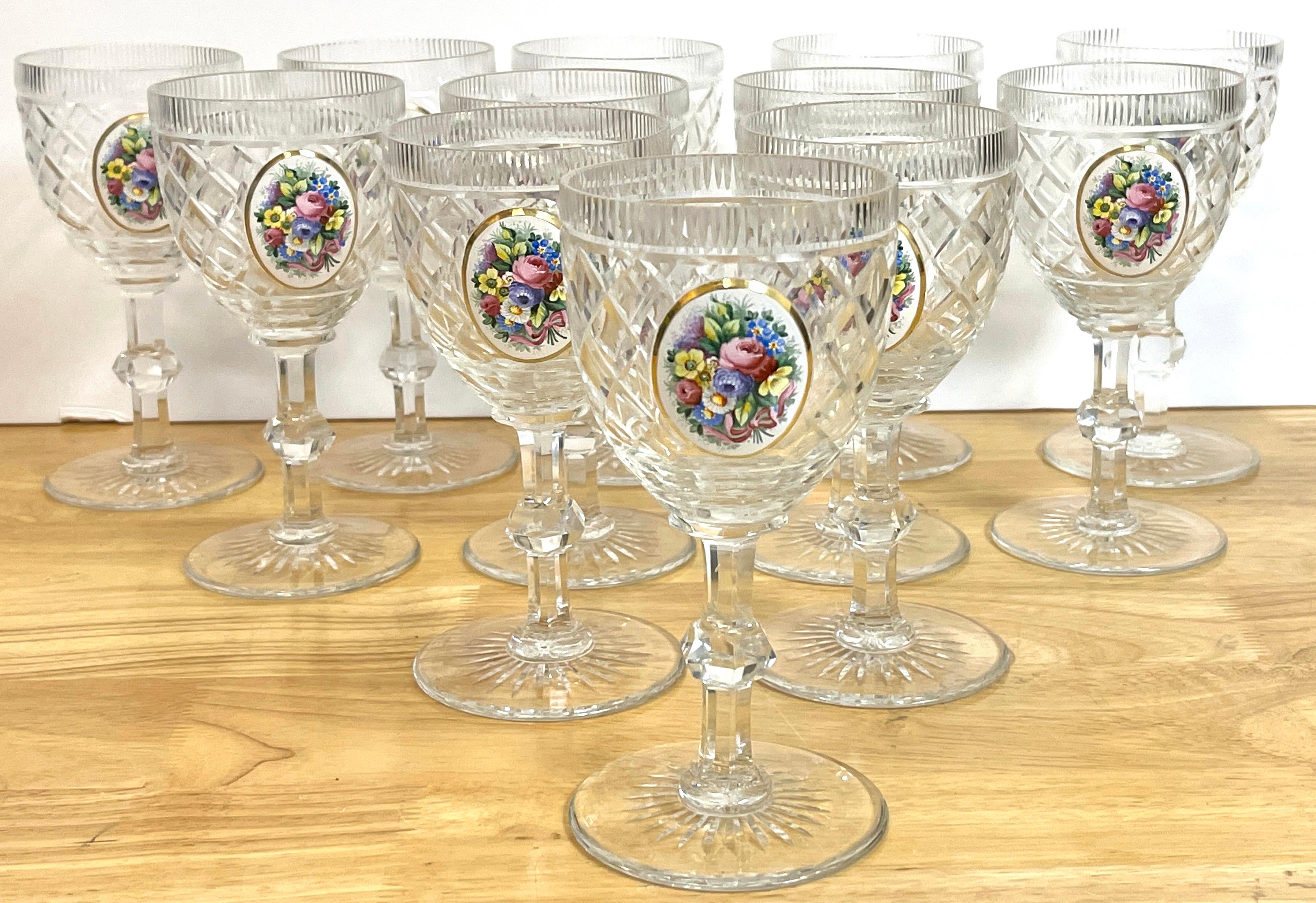 12 Exquisite Moser floral enameled cut to clear enamel water/wine goblets, 
Each one with a fine cross-hatched colorless crystal stems, with an oval enameled floral bouquet. 
Unmarked.
Measures: 7 height x 3.25 /3.25 / 3.75 deep.
