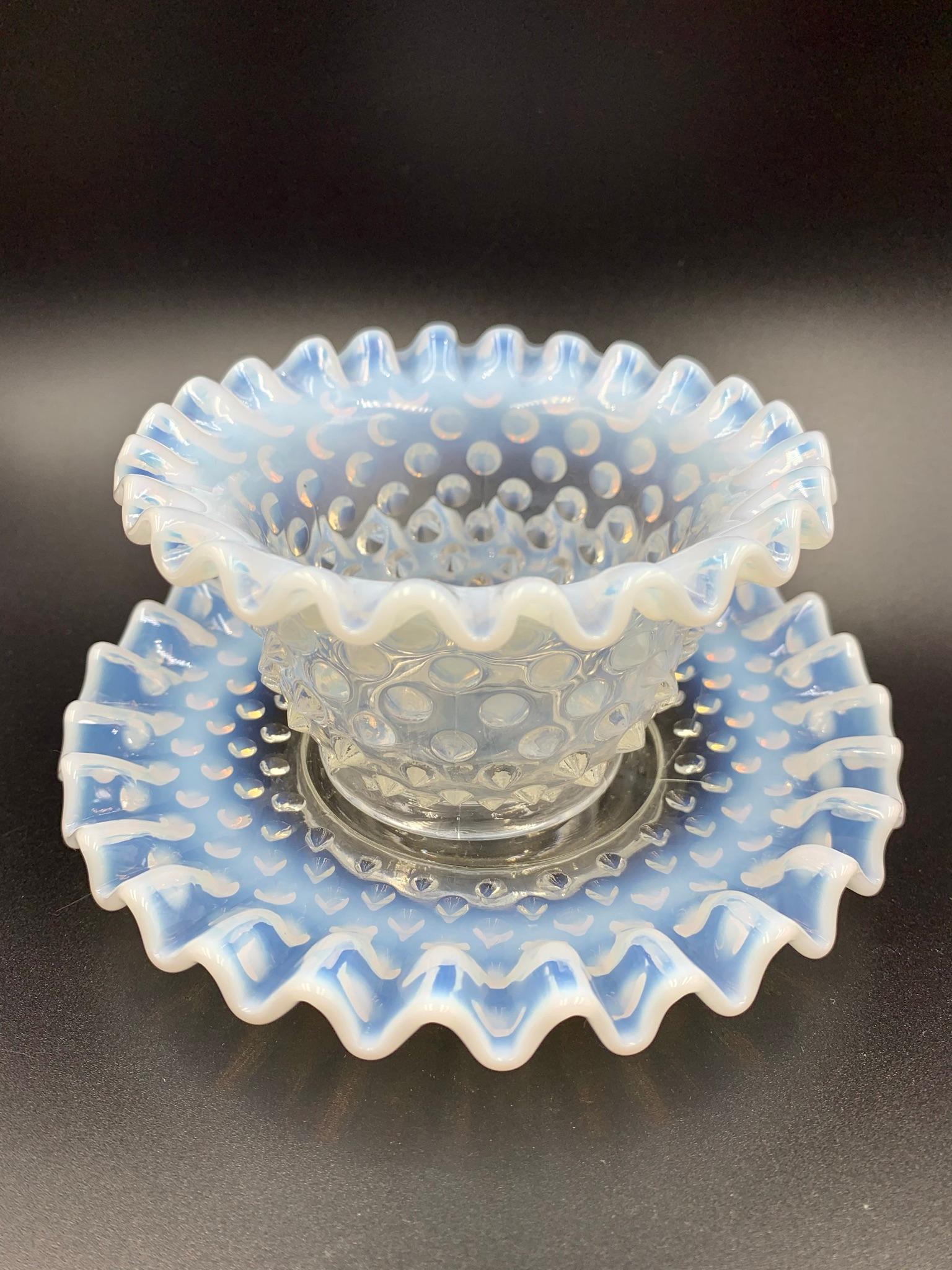 Fenton produced Hobnail from 1939 to 1964, this collection includes 12 sets of mayonnaise bowls and underplates in a light blue opalescent color. This set would be great to serve fruit, ice cream or custard. These pieces have seams as seen in the