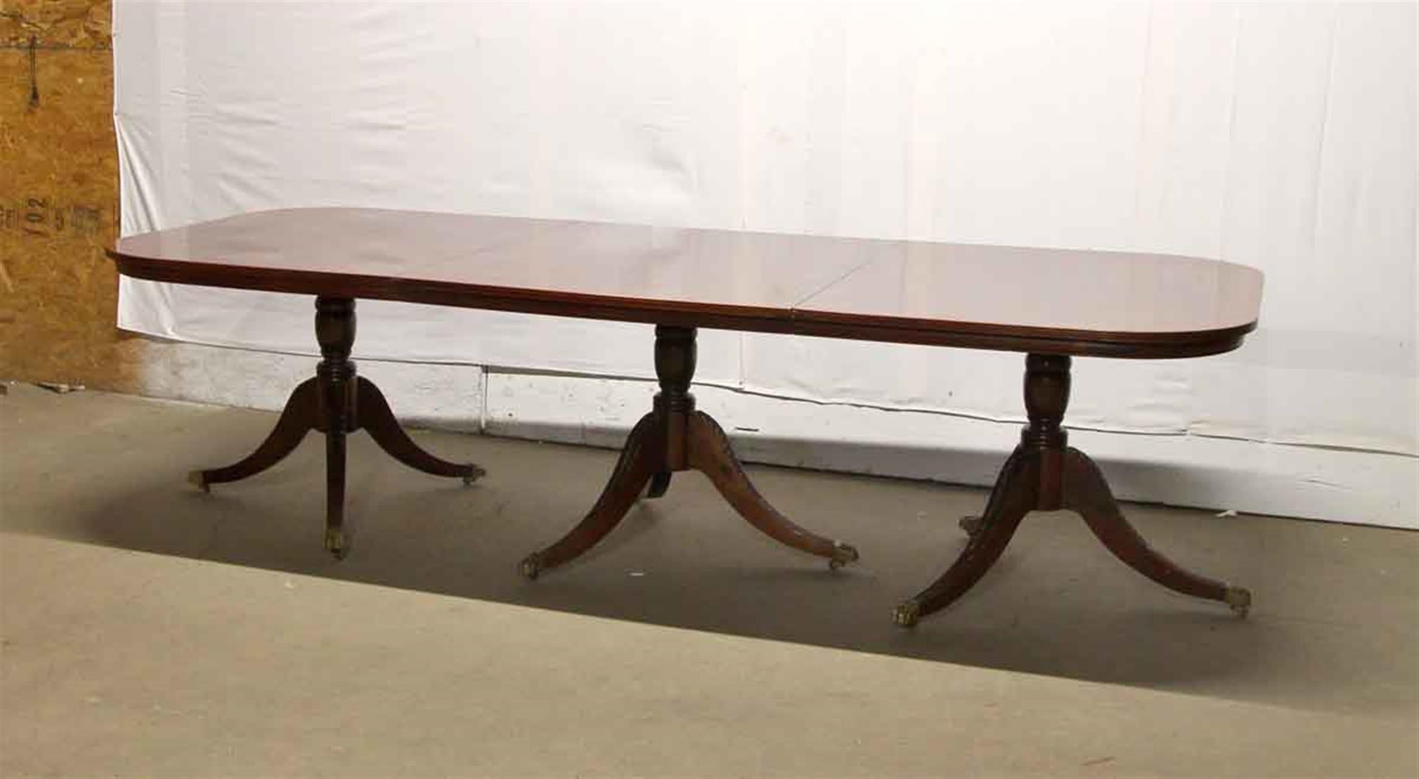 American Duncan Phyfe Style Mahogany Dining Table with Extensions and Brass Feet