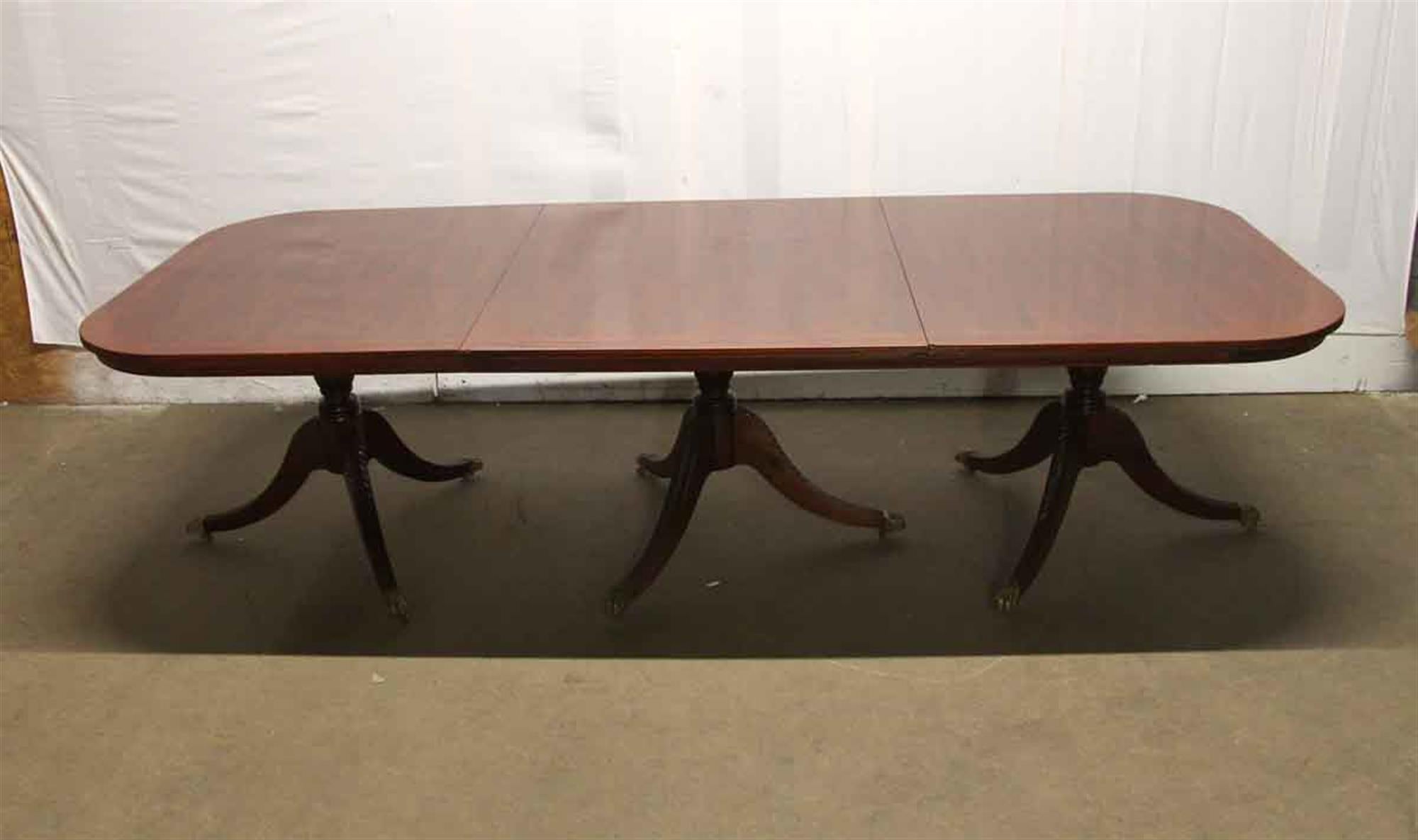 Late 20th Century Duncan Phyfe Style Mahogany Dining Table with Extensions and Brass Feet