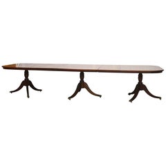 Duncan Phyfe Style Mahogany Dining Table with Extensions and Brass Feet