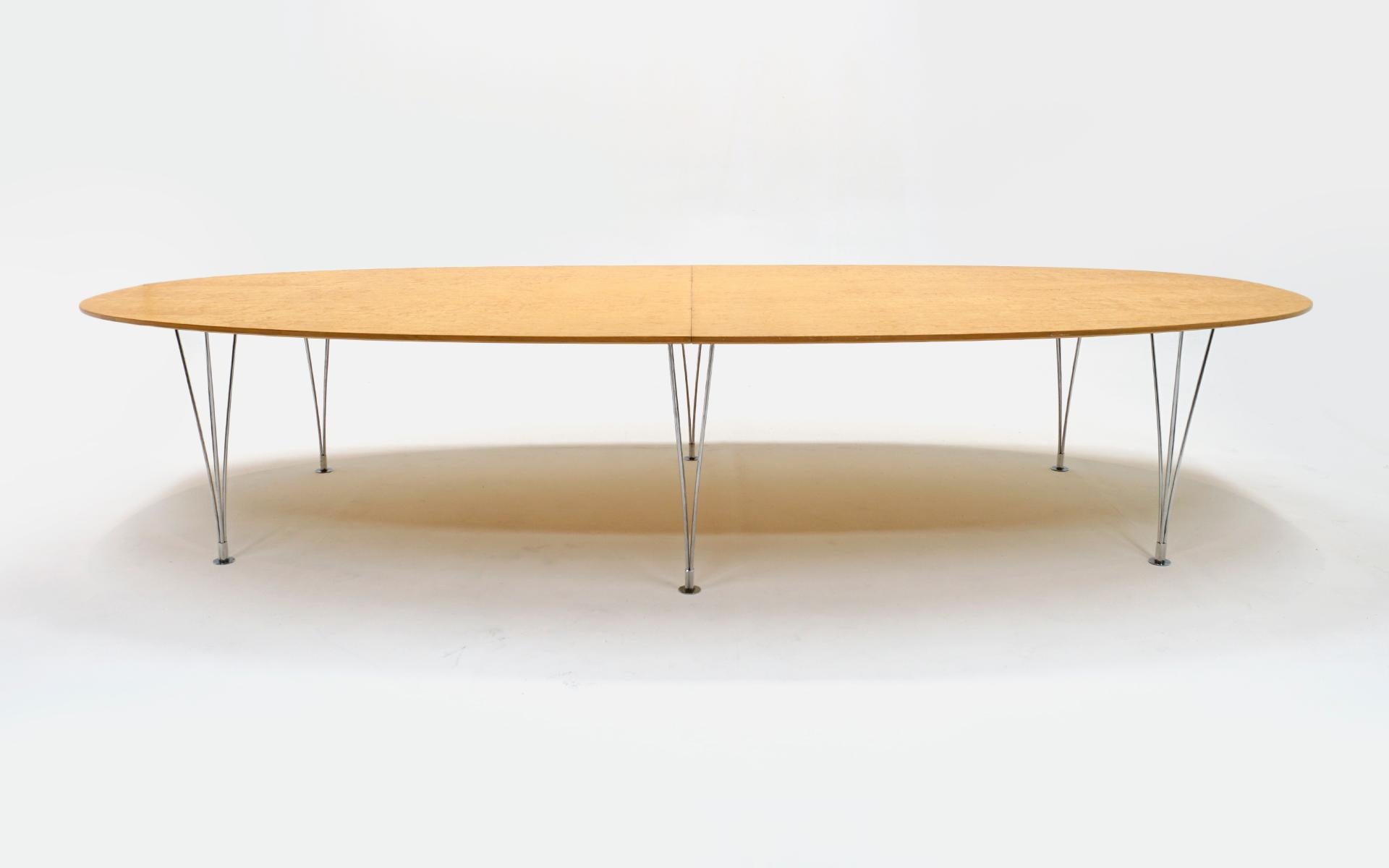 Super Ellipse dining / conference table in rare Karelian Birch Burl.designed by Arne Jacobsen, Piet Hein and Bruno Mathsson for Bruno Mathsson International, Sweden, 1986.  Almost twelve feet long and just over five feet deep.  Six chromed steel