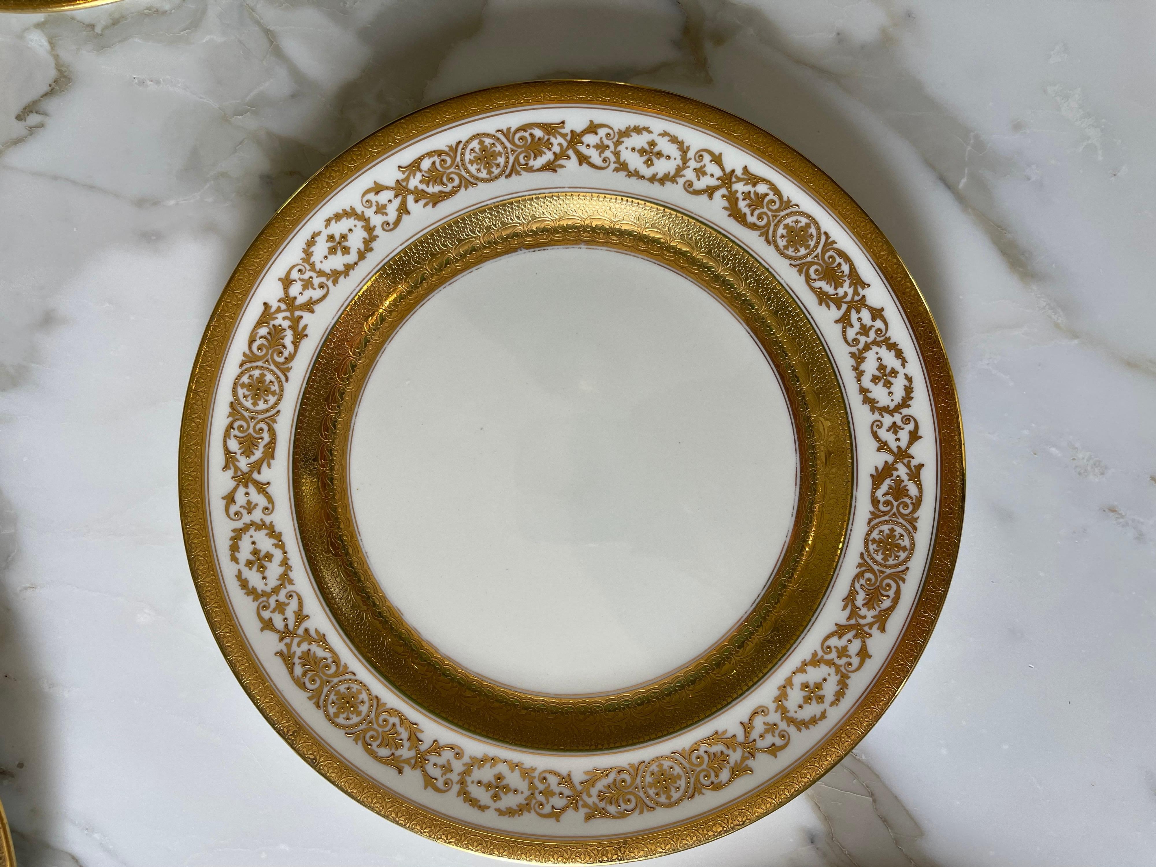This beautiful set of 12 English crown Sutherland porcelain dinner plates was made ca 1890-1910.
The Gold border and hand applied raised Gold makes them special. 
Makers Mark on the back and the number “3821”
Gilt bottom rim.