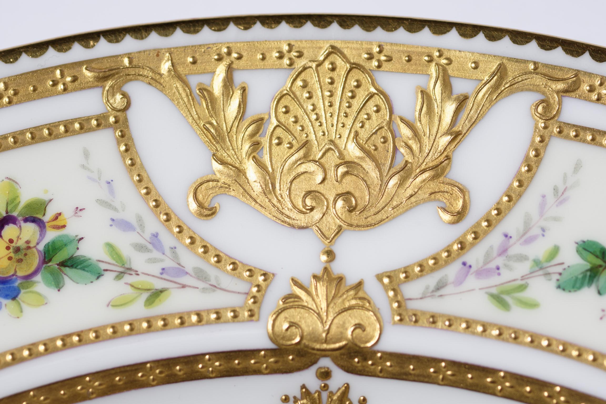 From one of the most admired Gilded Age factories, Minton England we have a set of 12 custom ordered dinner plates with exquisite raised tooled gilding. The collars feature fan flower and shell cartouches with all over triple gilt bead details. Hand