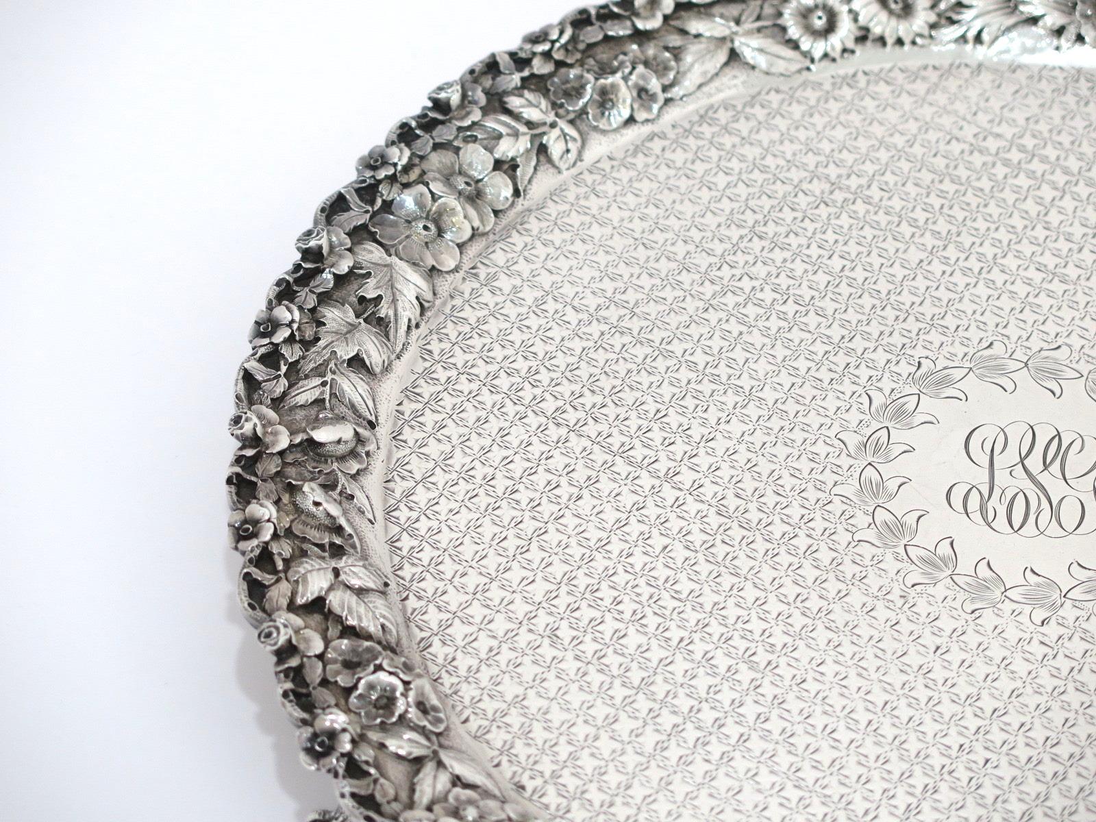 Dimensions: 12 x 1 3/8 in

Weight: 28.6 toz

The floral repousse border is in excellent condition.
