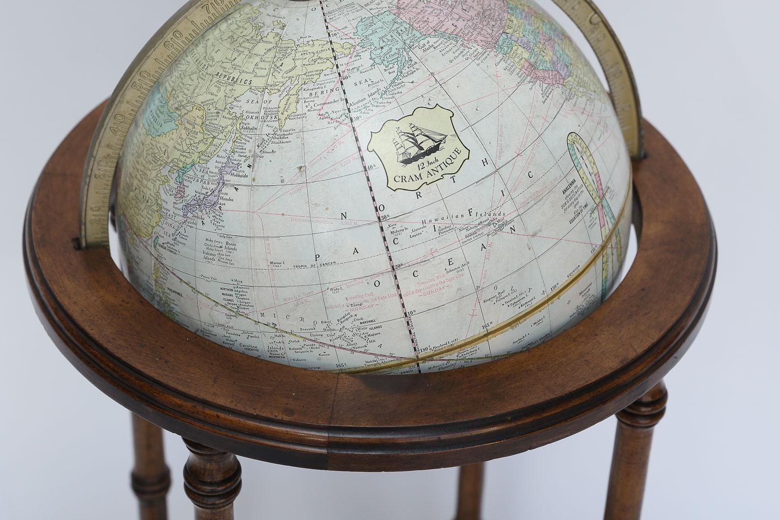 world globe on wooden stand