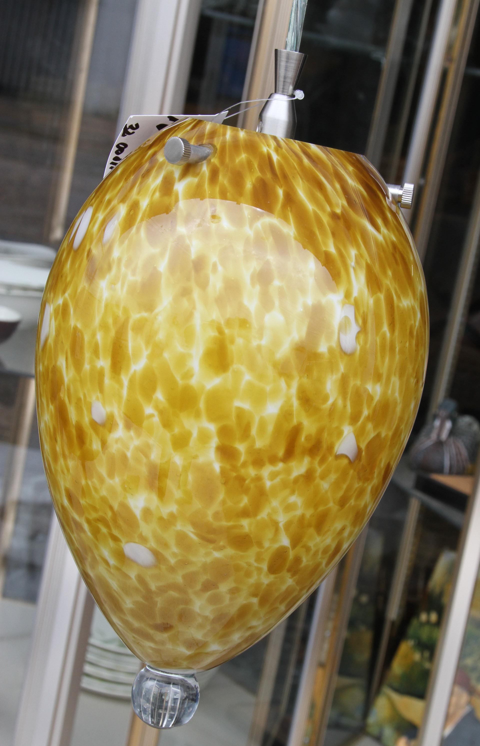 Italian Murano Glass Pendant

Stunning patterned satin gold and clear Murano glass light fixture. 
12