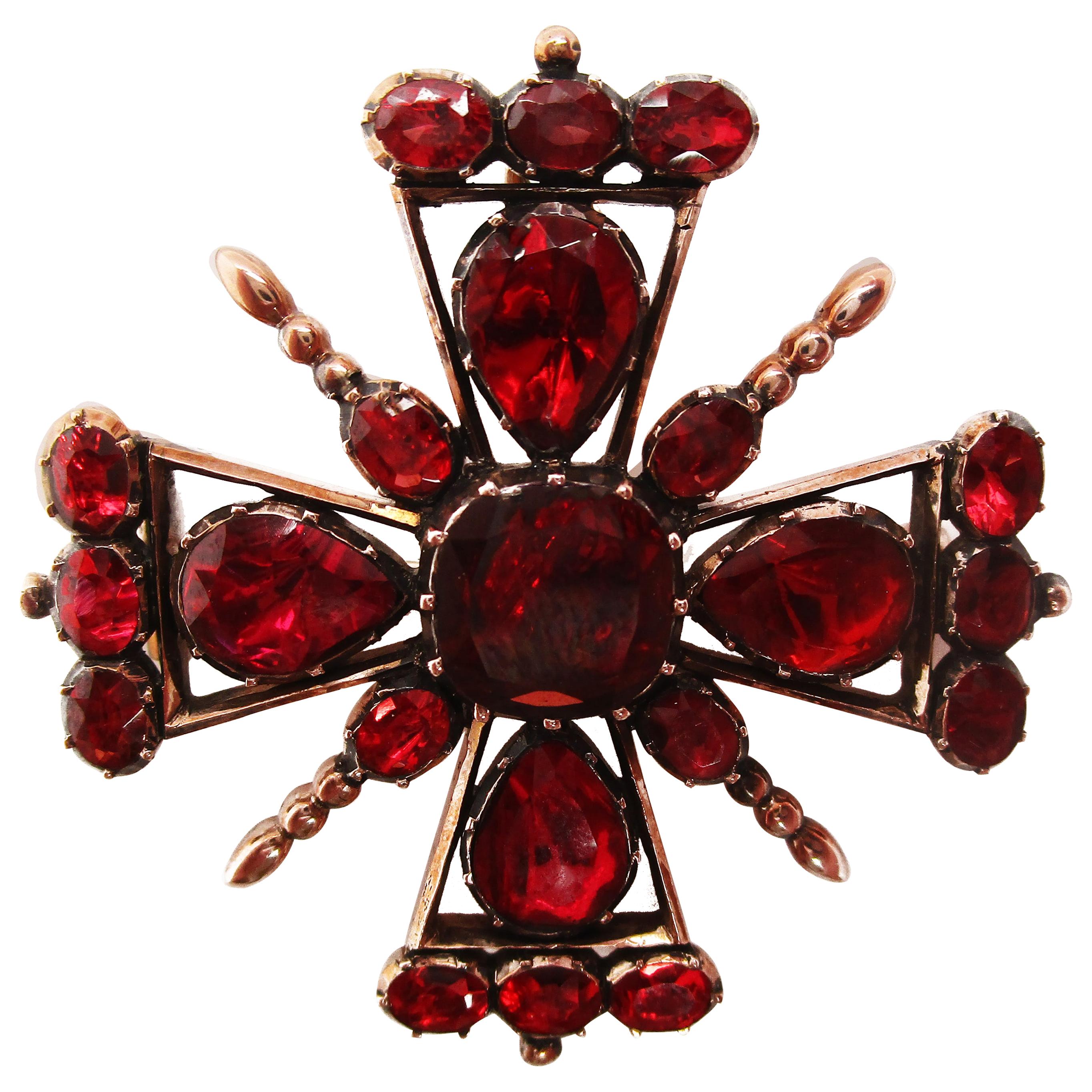 This fantastic pin pendant is in 12k rose gold and features some of the most beautiful garnets you will ever see! The contrast between deep red garnet and rose gold is enchanting and enthralling. The unique layout of the pin evokes a sense of