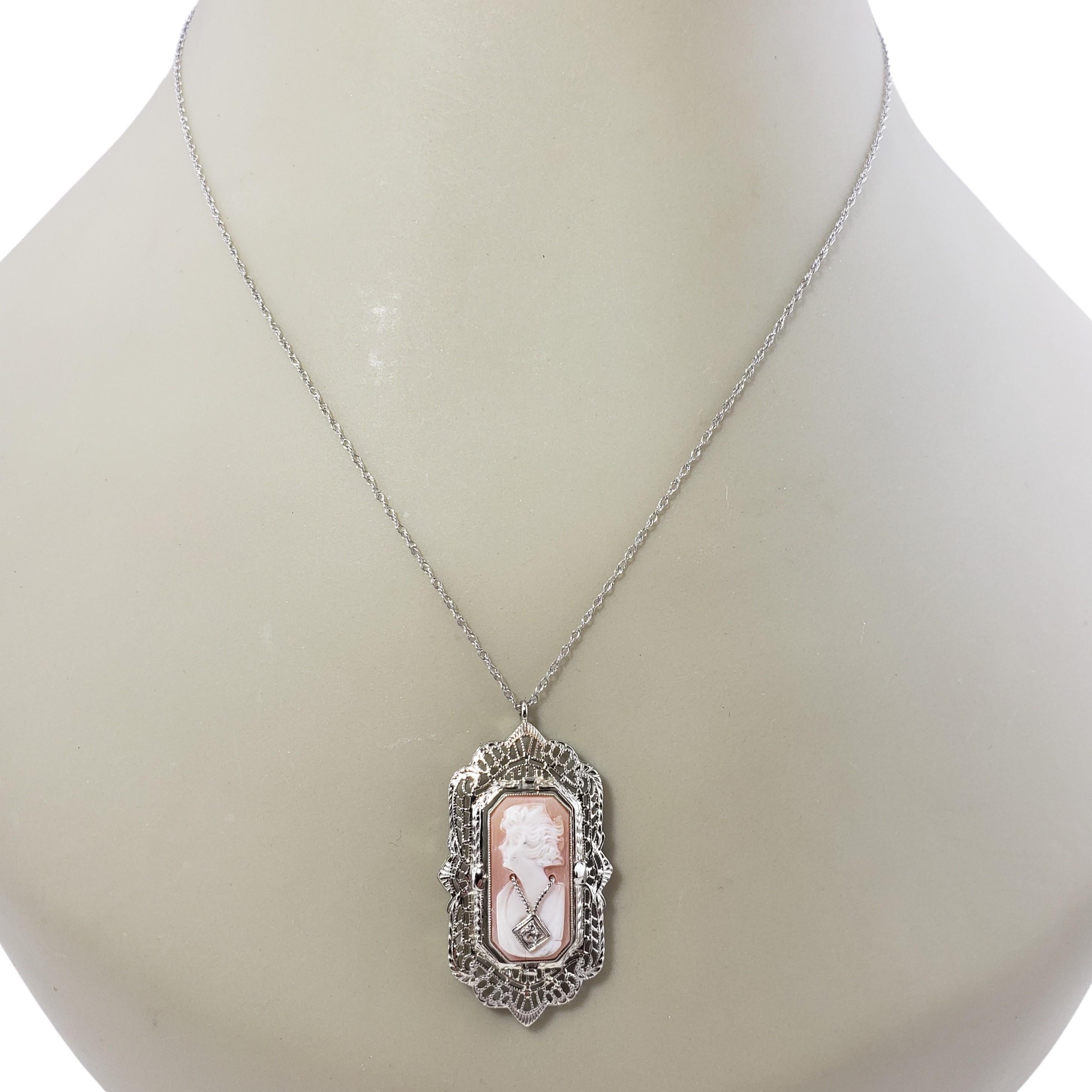 Vintage 12 Karat White Gold and Diamond Reversible Cameo Pendant-

This stunning reversible 12K white gold filigree pendant pictures a lovely lady in profile decorated with one round single cut diamond on one side. The reverse side features elegant