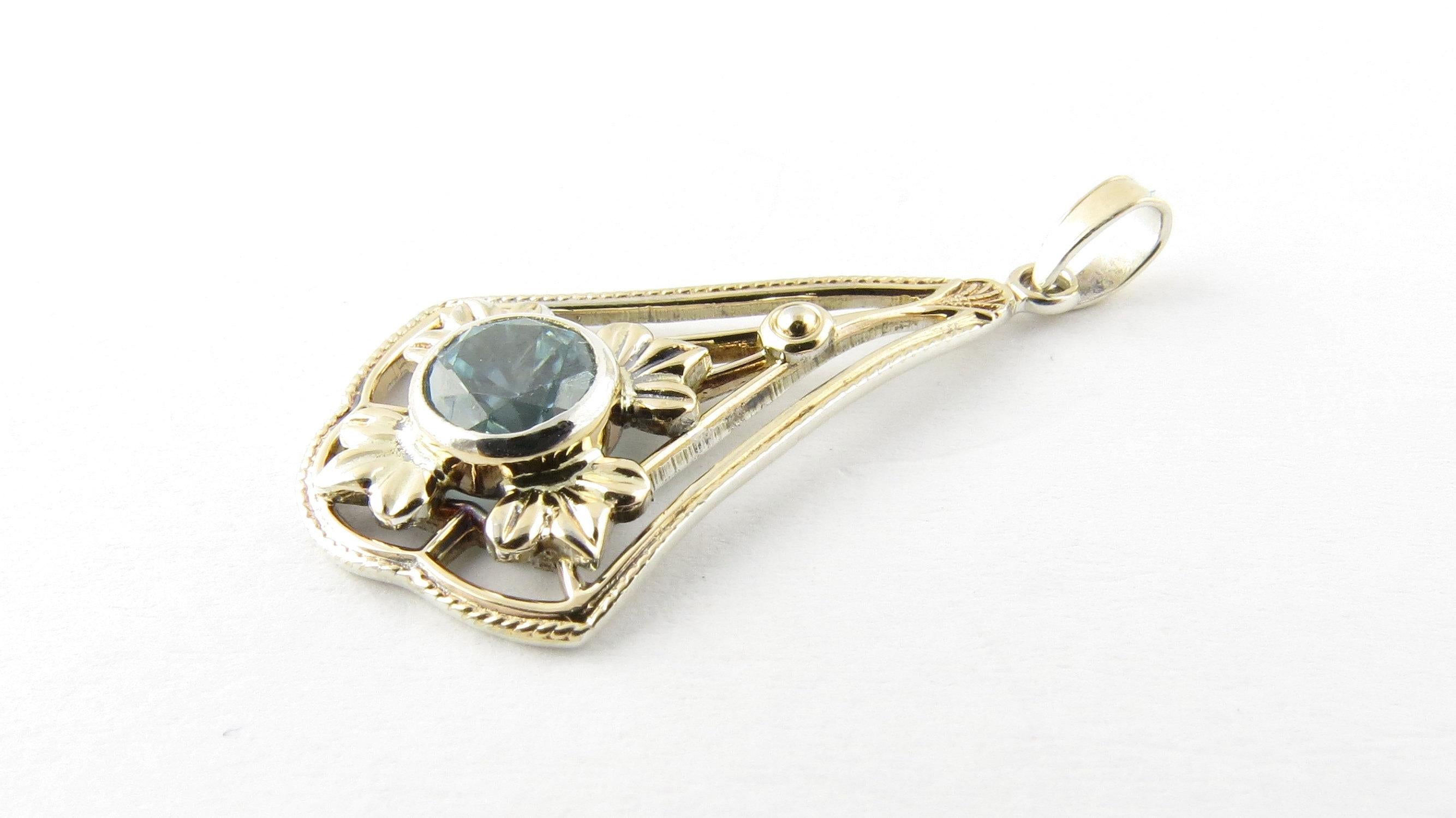Vintage 12 Karat White and Yellow Gold and Sterling Silver Blue Gemstone Pendant- 
This lovely pendant features one round sky blue gemstone (6 mm) set in beautifully detailed 12K white and Yellow gold and sterling silver. 
Matching brooch:3715