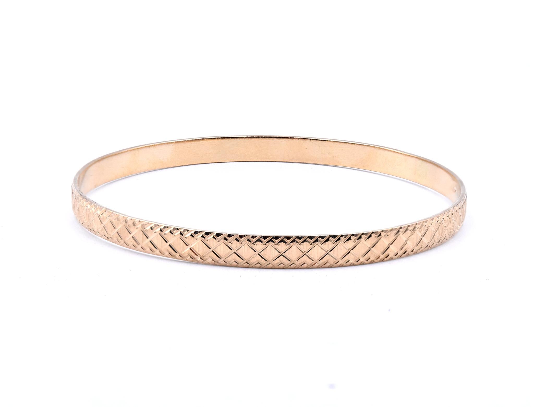 Designer: custom
Material: 12K yellow gold
Dimensions: bracelet will fit up to a 8-Inch wrist
Weight: 16.30 grams

