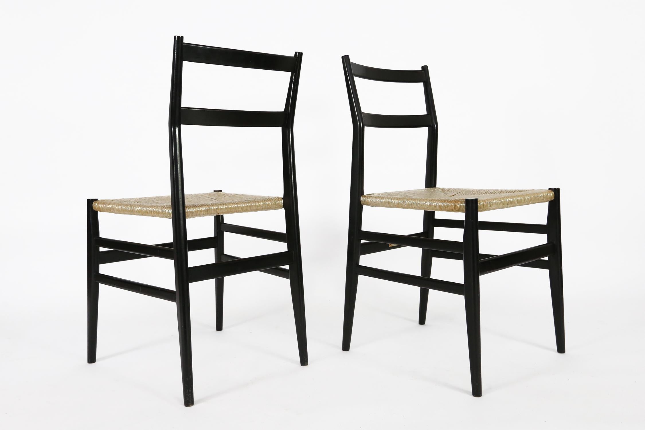 Set of 12 Gio Ponti Leggera chairs edited by Cassina, these are all 1960s editions. They are all very sturdy.
8 chairs have their original Cassina label and are in a slightly better condition of paint and canework,
4 chairs have no labels and are
