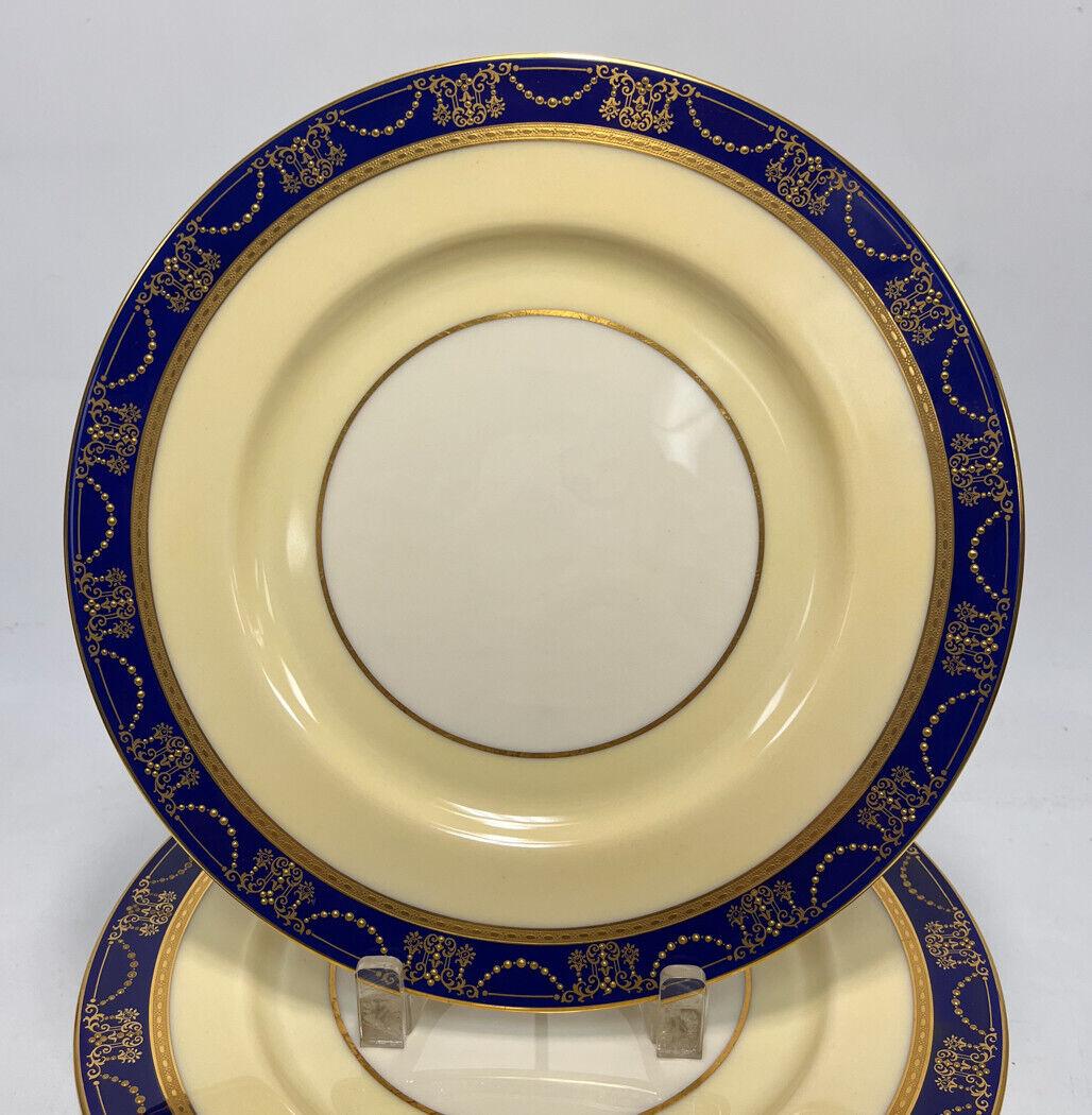 12 Lenox Porcelain Dinner Plates, circa 1920. Cobalt blue band around the rims with raised gilt  swags and floral bouquets. Lenox porcelain marks to the underside. 

Additional Information:
Material: Porcelain 
Brand: Lenox
Color: Blue
Type: Dinner
