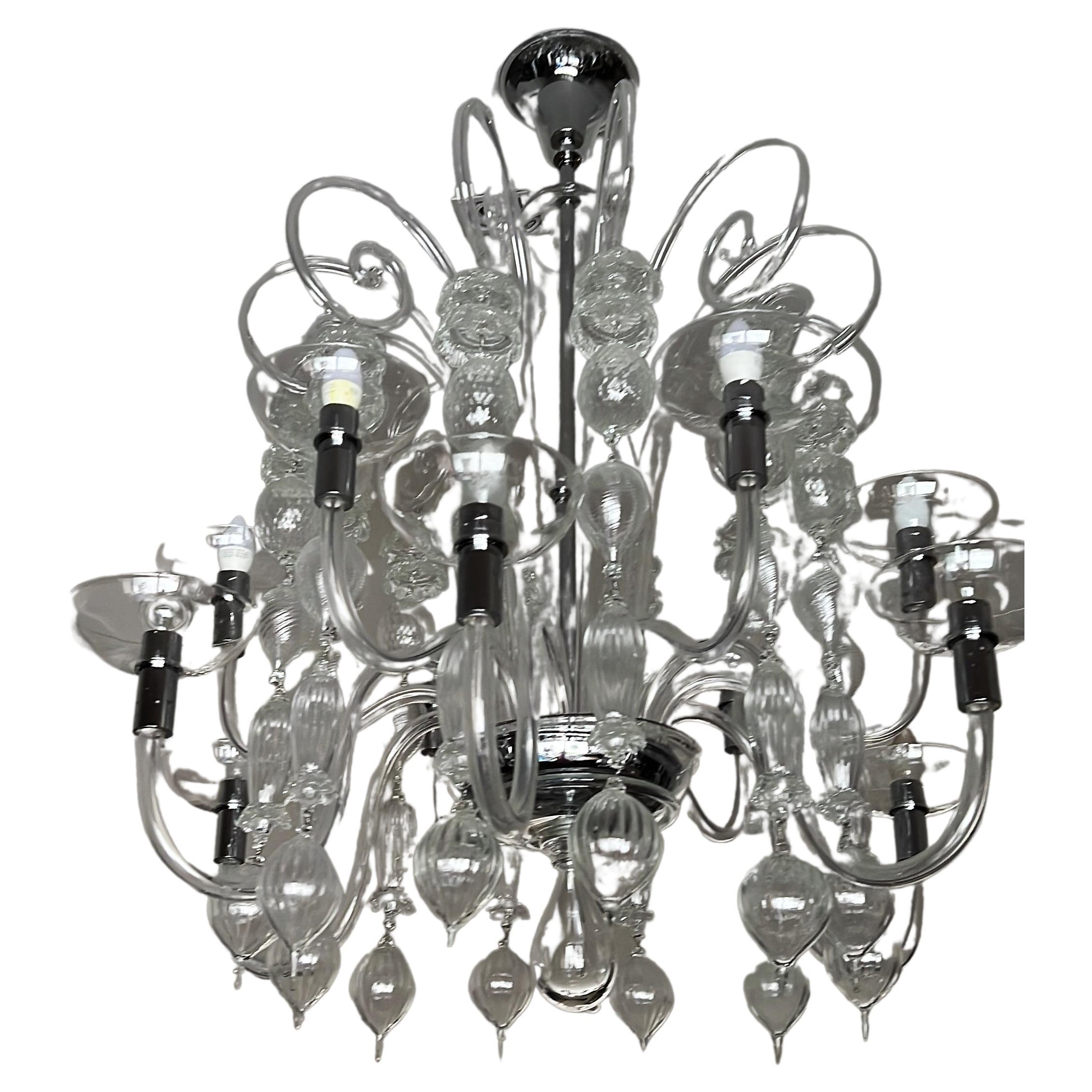 12 Light chandelier designed by Carlo Scarpa for Venini , Model 99.37 in Murano Italy.
This Chandelier originally designed in 1940 was manufactured in 2009. 
All the pieces are in great condition with no breaks.
Measures: 
Height is 43