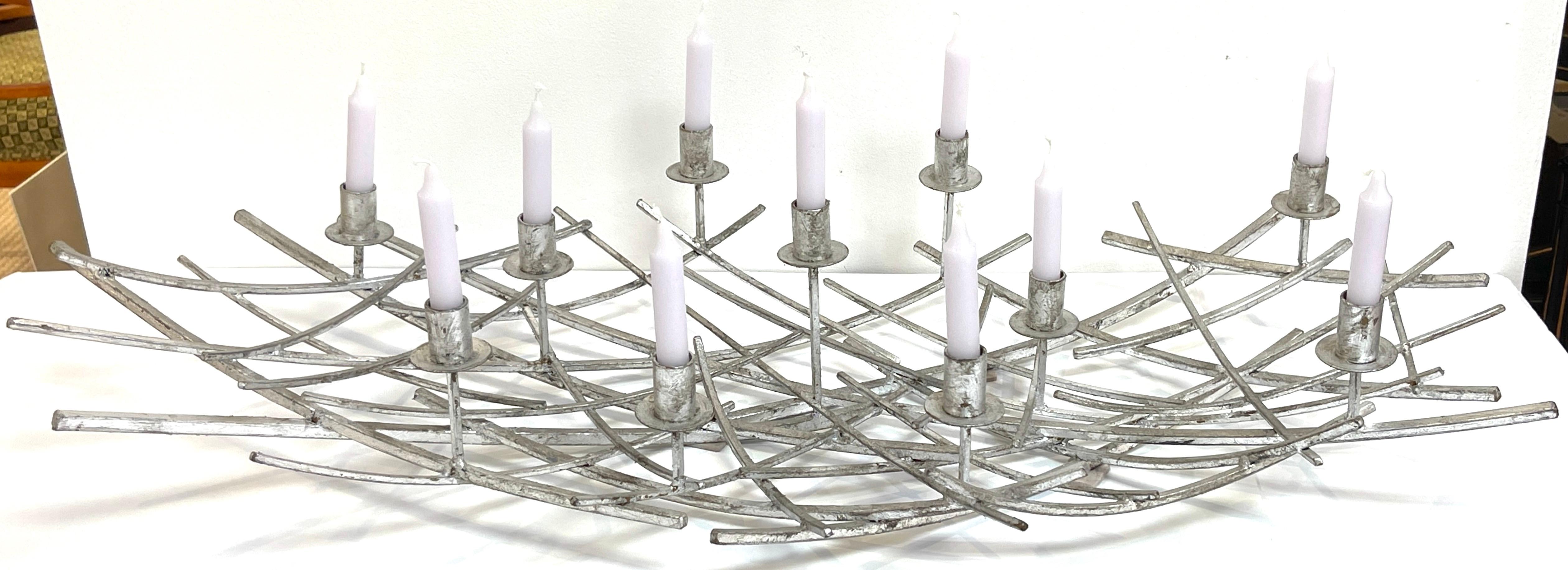 12 Light French Modern Kinetic Silvered Metal Candelabra Centerpiece  
France, Circa 1980s

A unique 12-Light French Modern Kinetic Silvered Metal Candelabra Centerpiece, made in France, originating in the 1980s. This remarkable piece boasts a