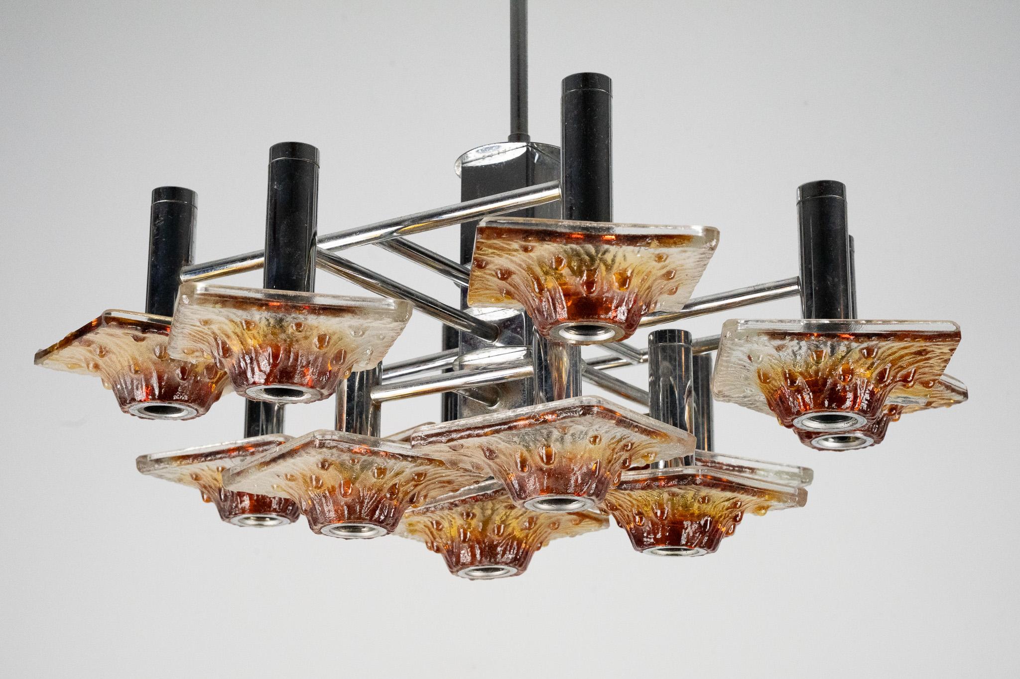 Italian 12-light Mazzega chandelier in amber and clear murano glass and chrome. Italy 70 For Sale