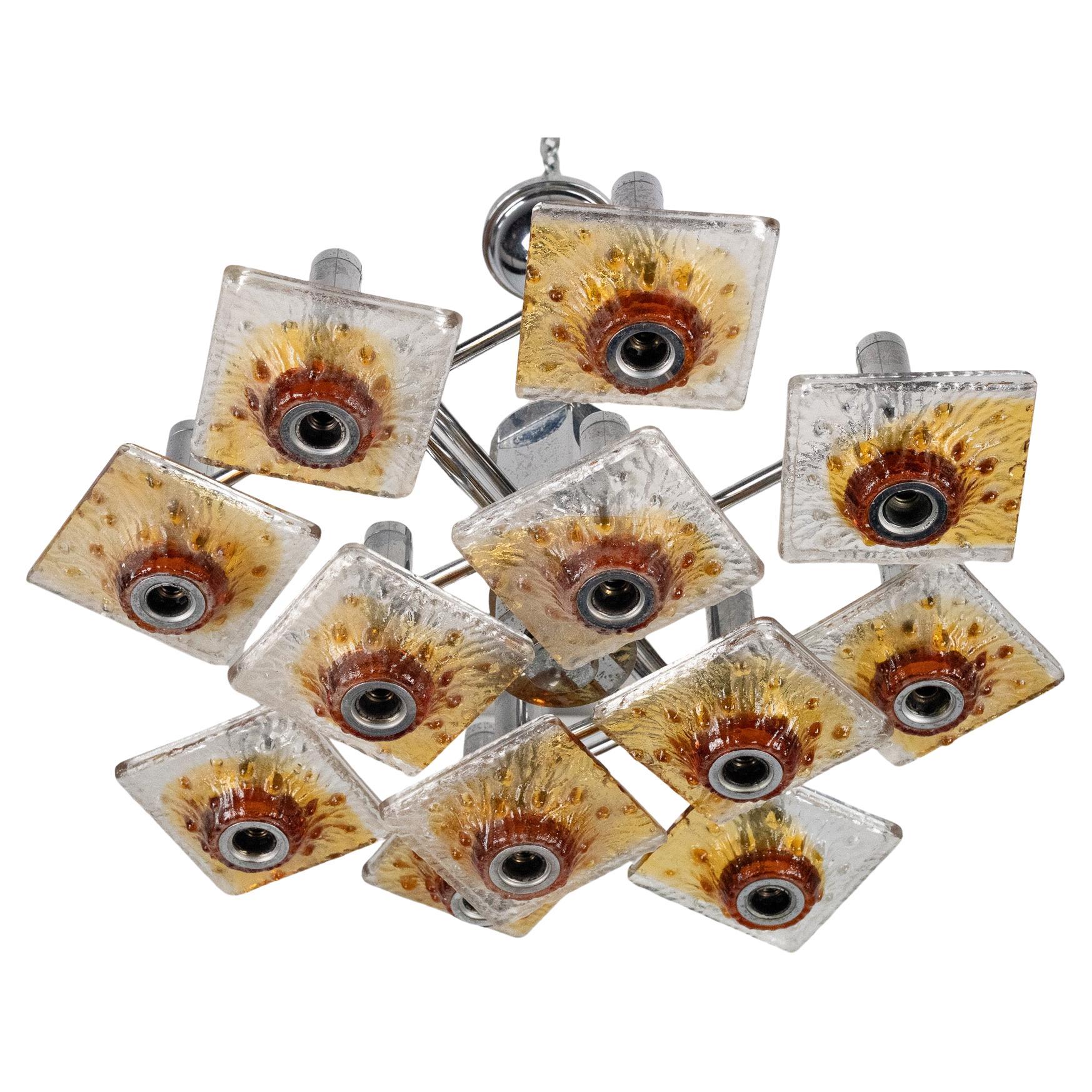 Lámpara de araña Mazzega de 12 luces en cristal de Murano ámbar y transparente y cromo. Italia 70