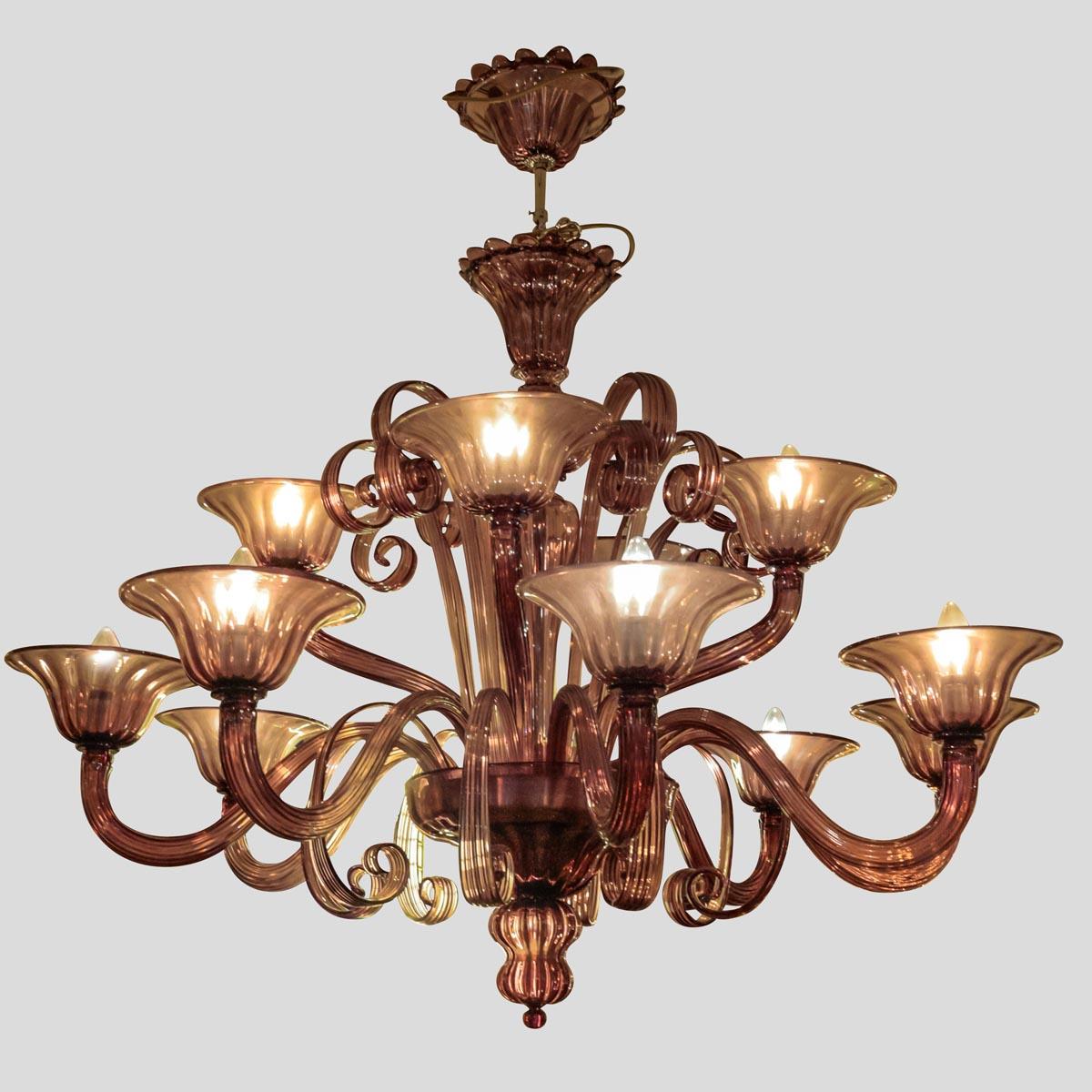 An outstanding Purple colour 12 lighter Classic with a modern touch Venetian chandelier designed by Cenedese and manufactured in their Murano’s furnace
Made in Italy. Signed on the bottom cup 
Completely hand blown each and every glass component